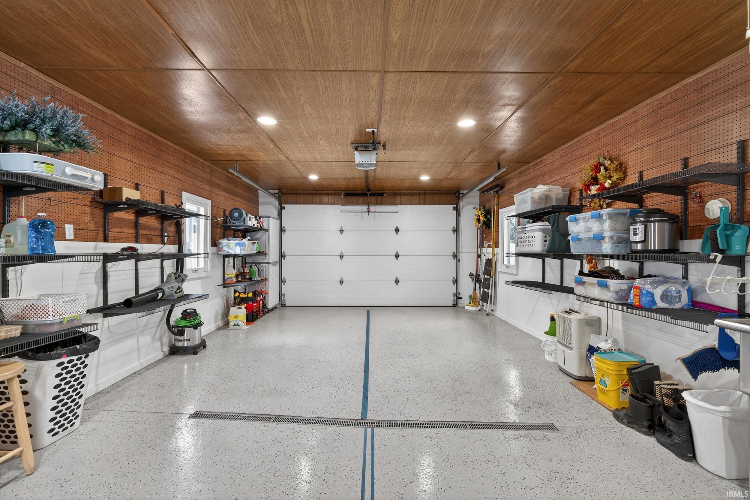 Garage featuring wooden ceiling