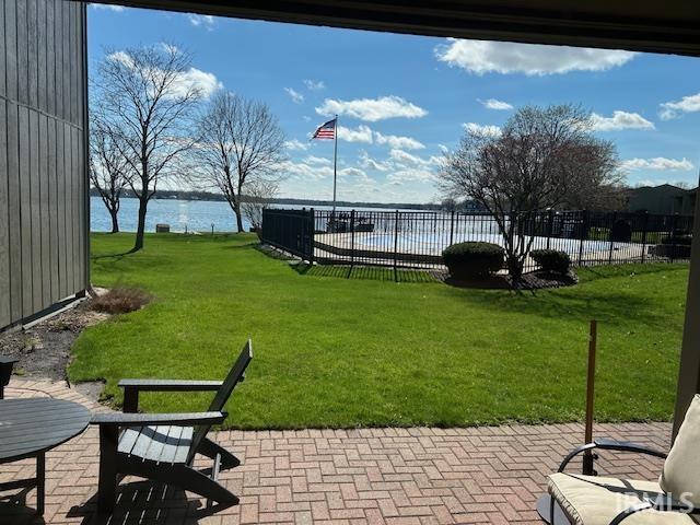 Surrounding community with a patio area, a water view, and a pool