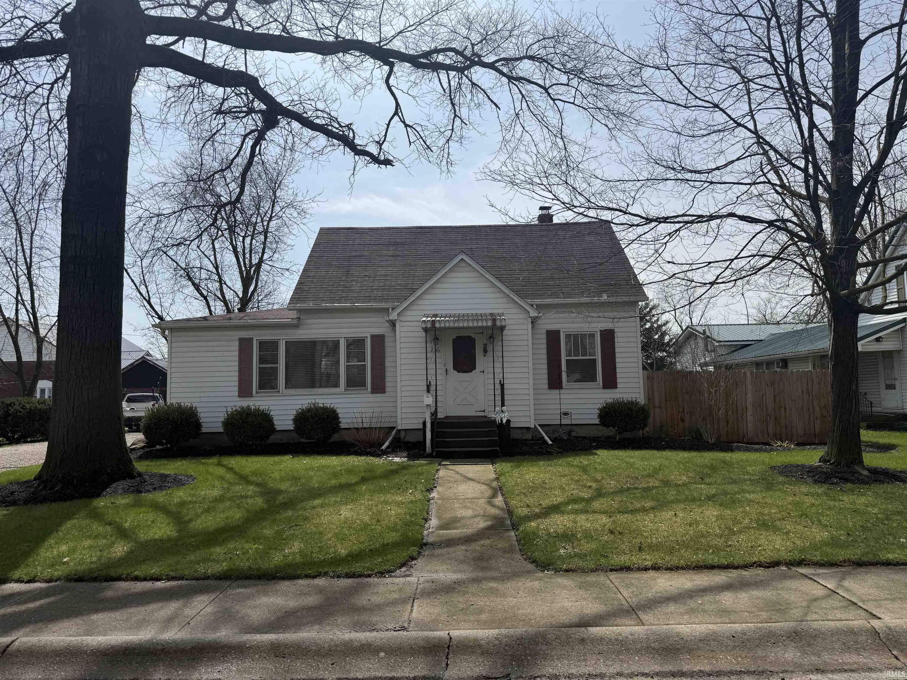 View of front of property featuring a shingled roof