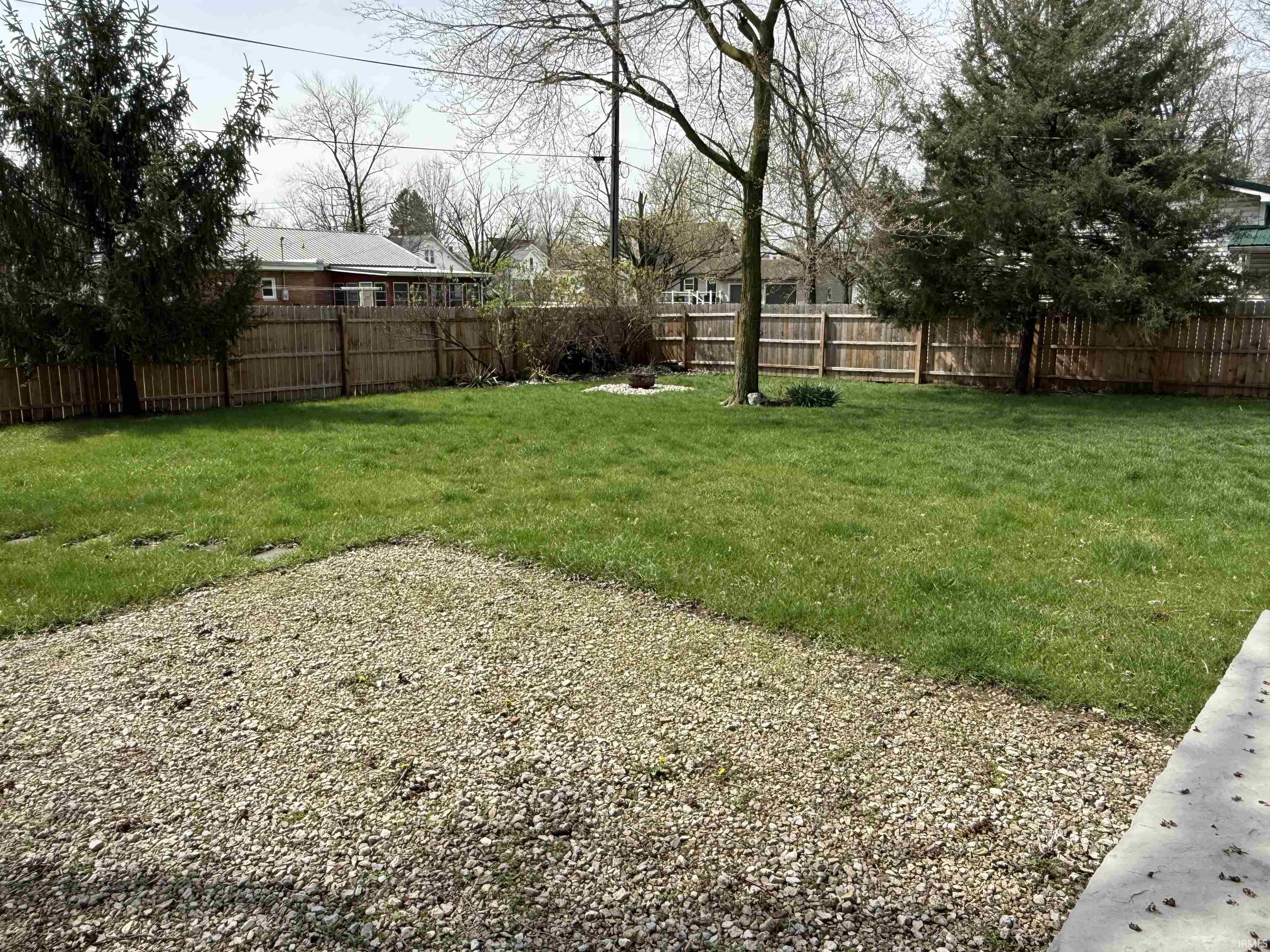 View of fenced backyard