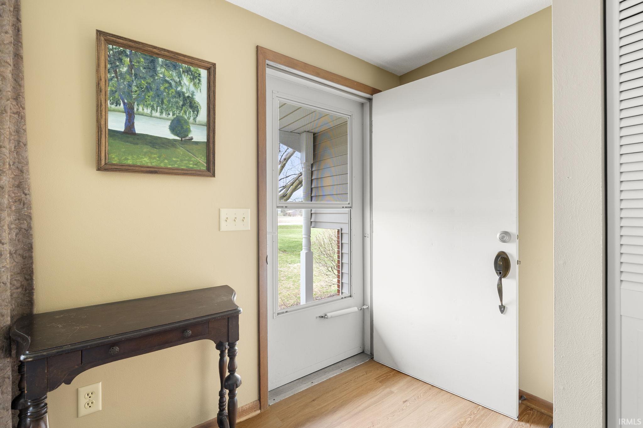 Entryway with wood finished floors