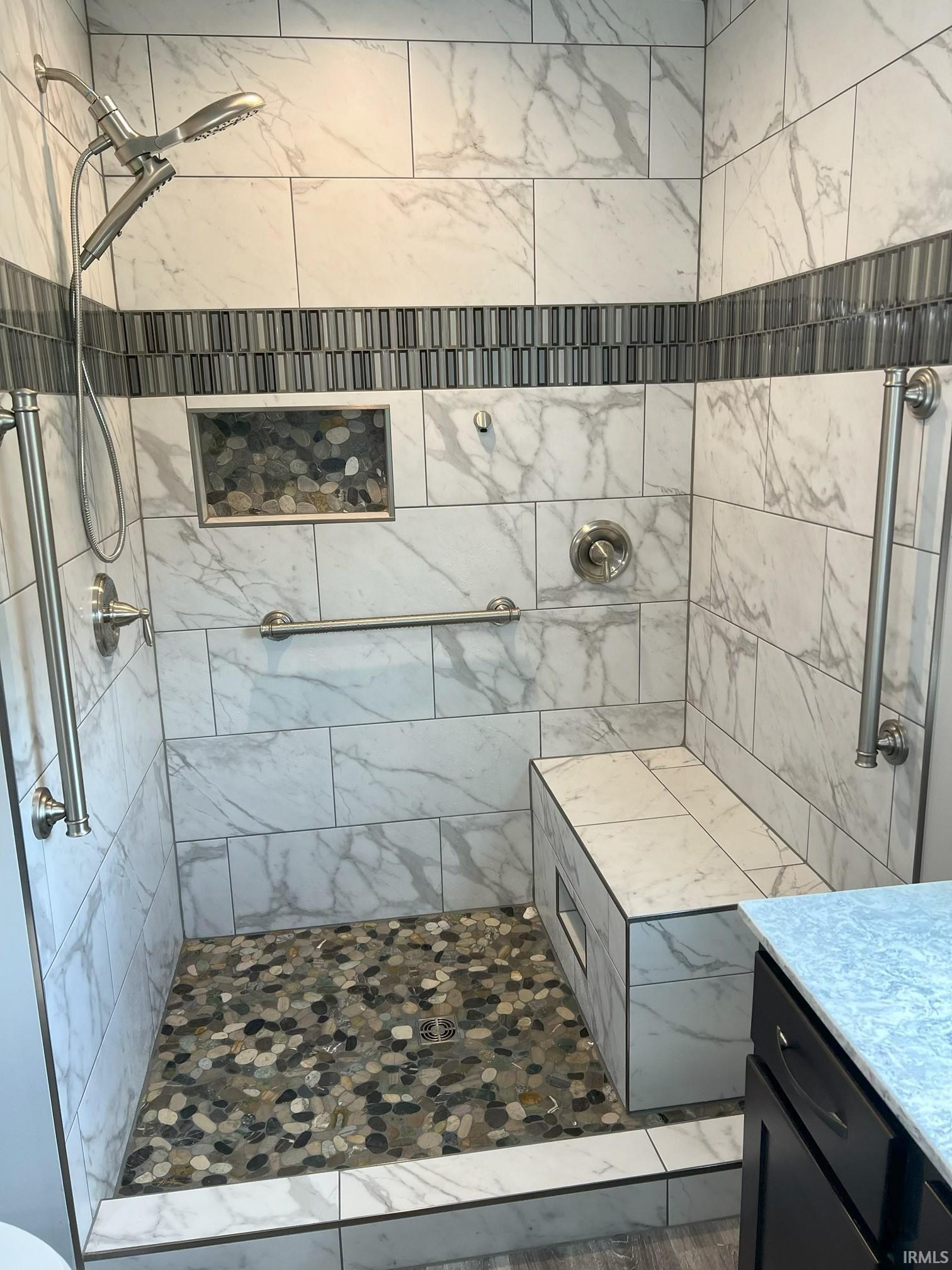 Bathroom with a stall shower and vanity