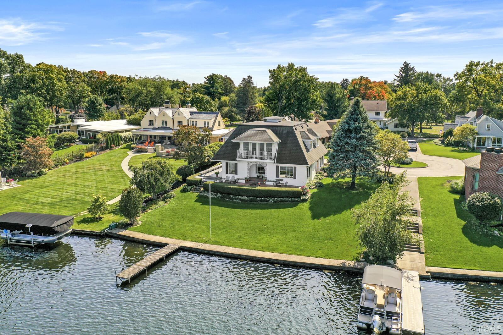 Aerial perspective of suburban area with a large body of water