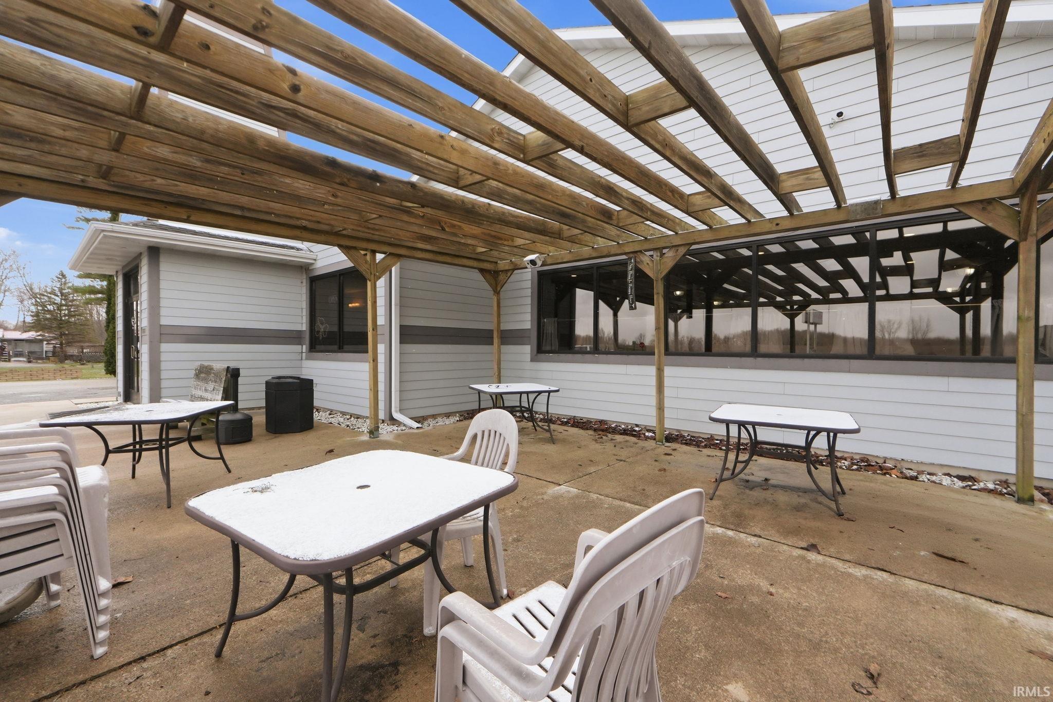 View of patio / terrace featuring outdoor dining area and a pergola