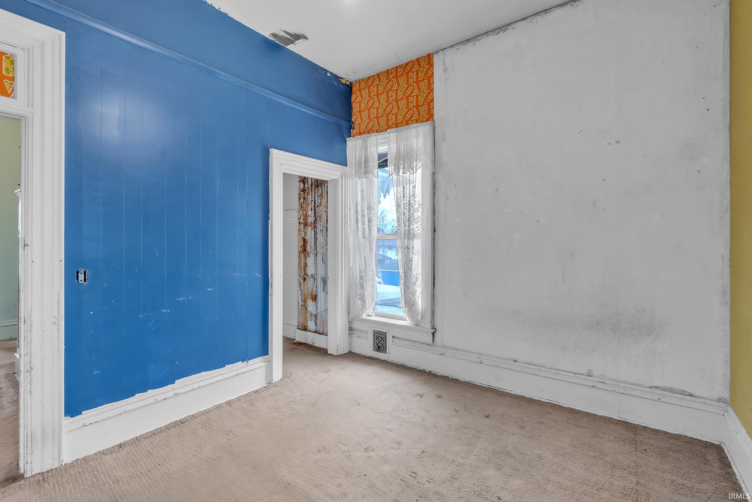 Spare room with carpet floors and baseboards