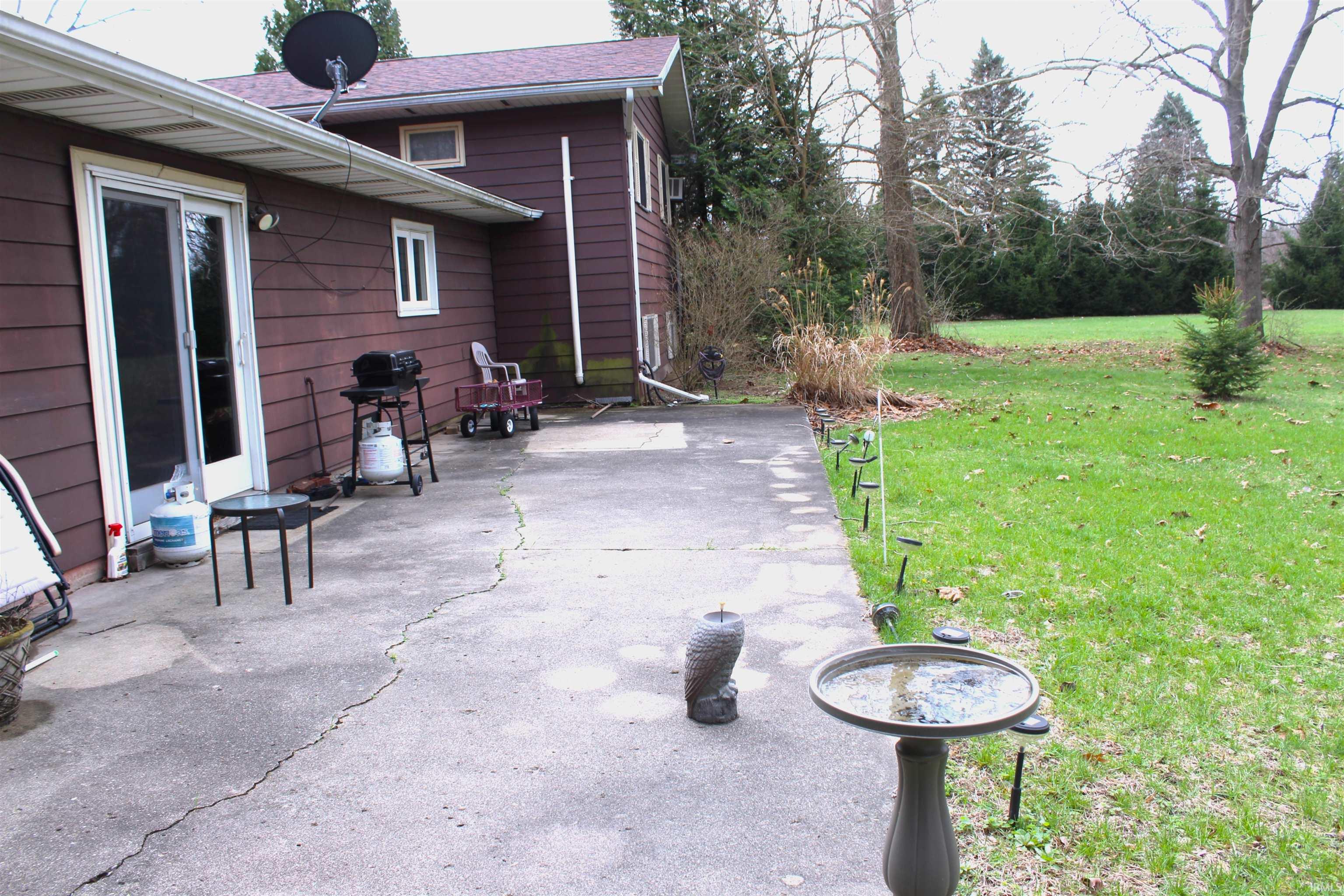 View of patio featuring a grill