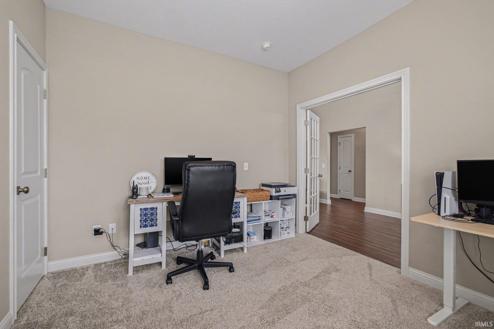 Office featuring carpet flooring and baseboards