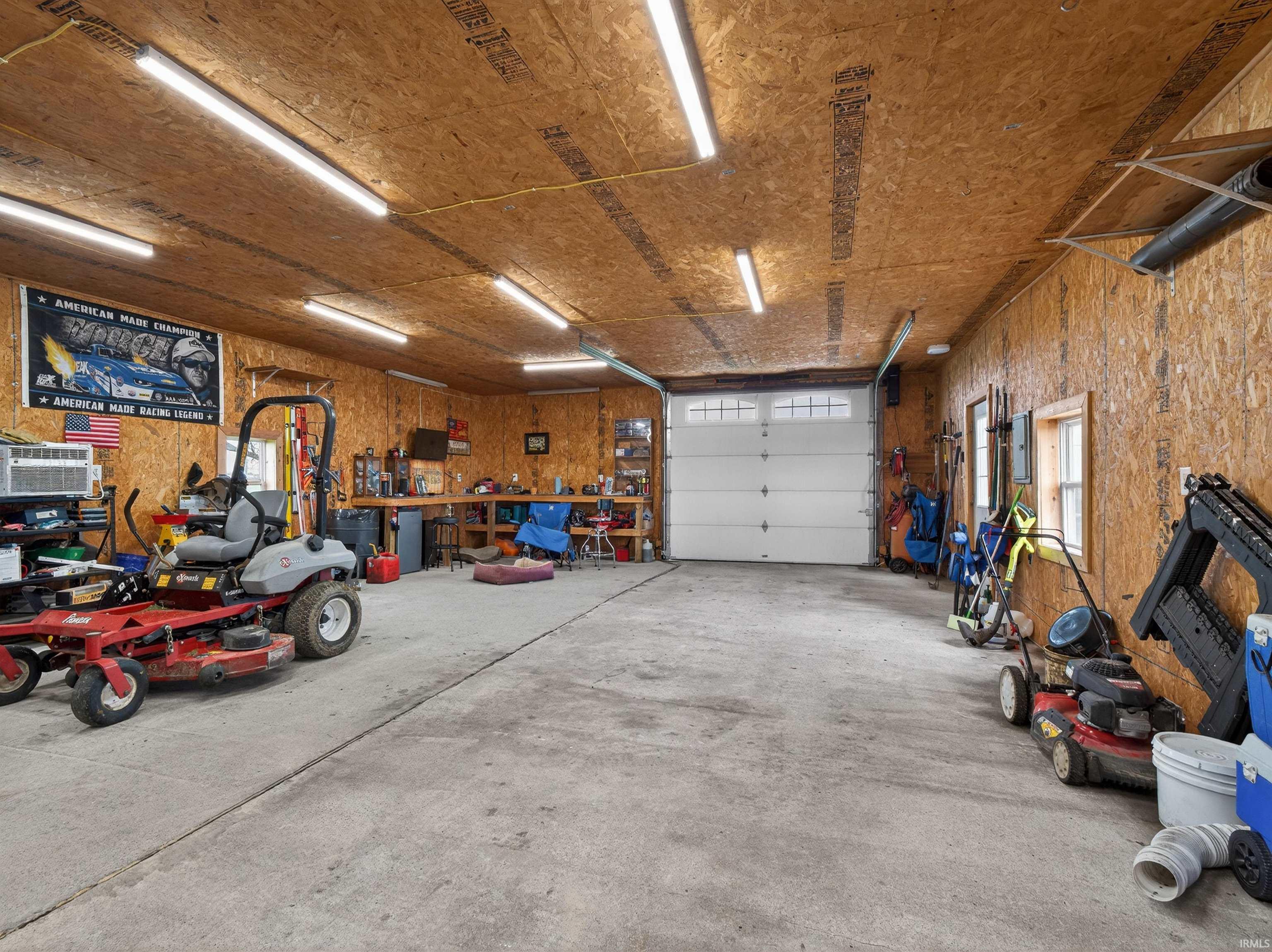 Garage featuring a workshop area