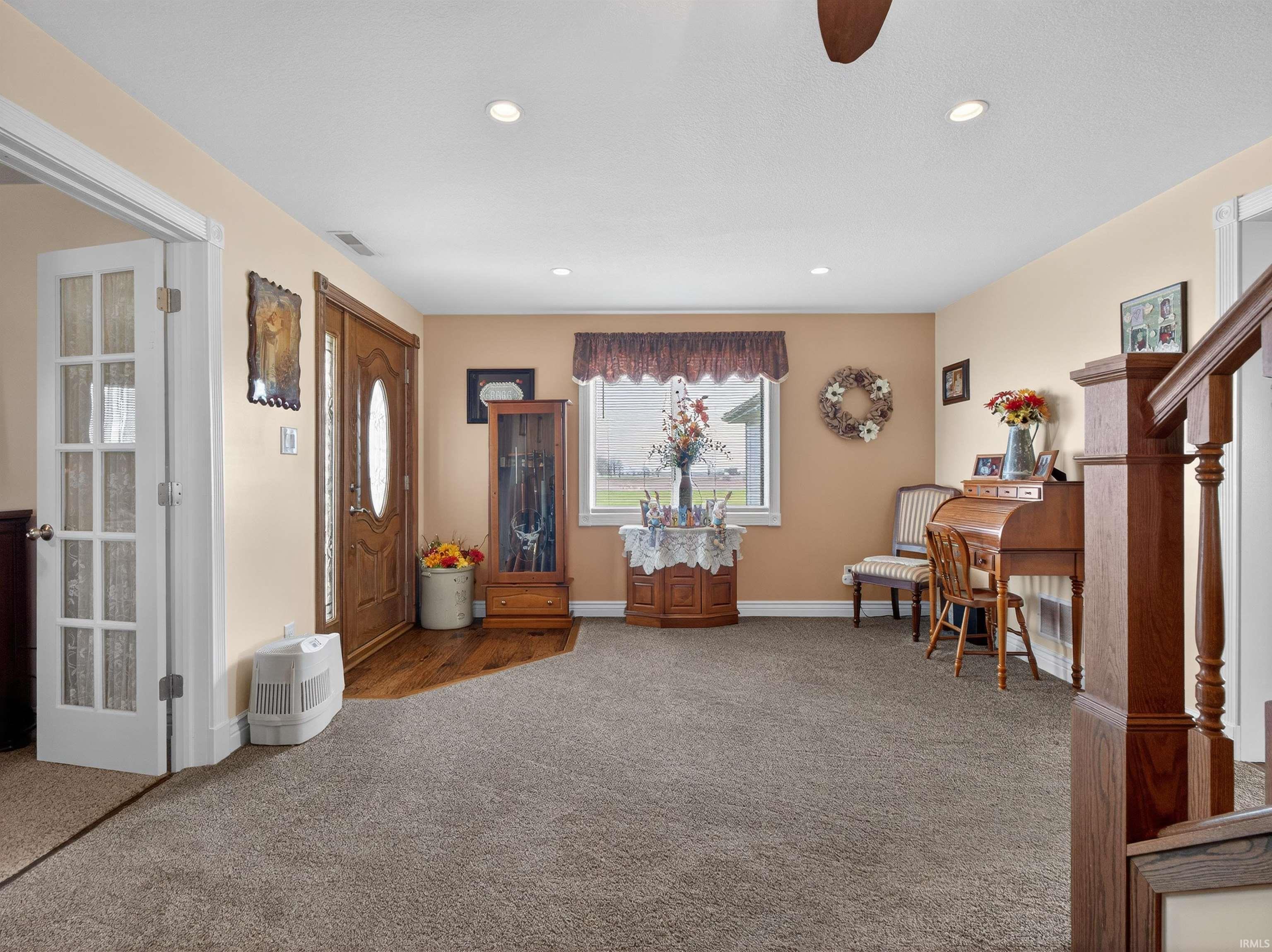 Sitting room featuring carpet flooring, recessed lighting, and a ceiling fan