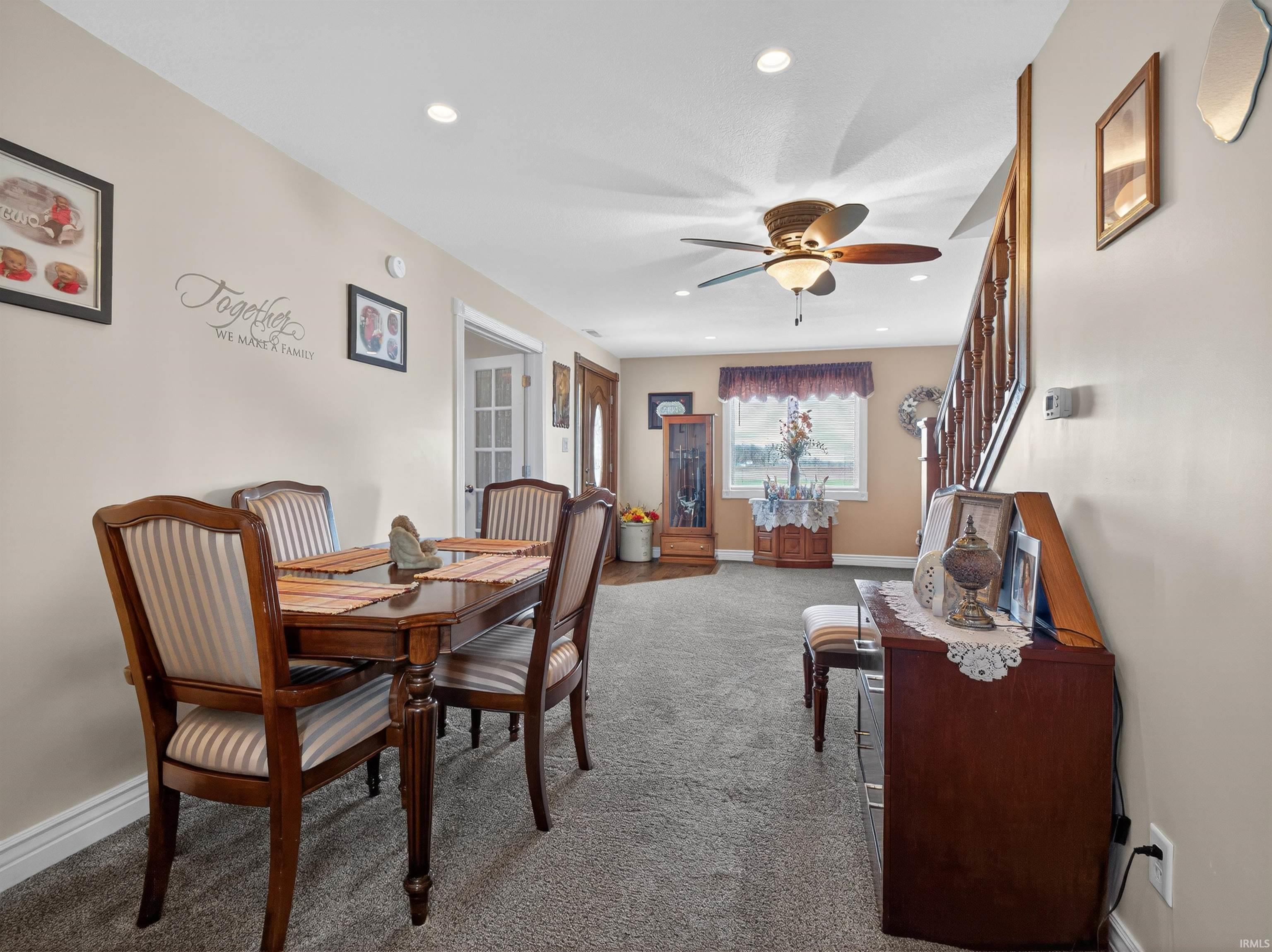 Dining area featuring a ceiling fan, carpet floors, and recessed lighting