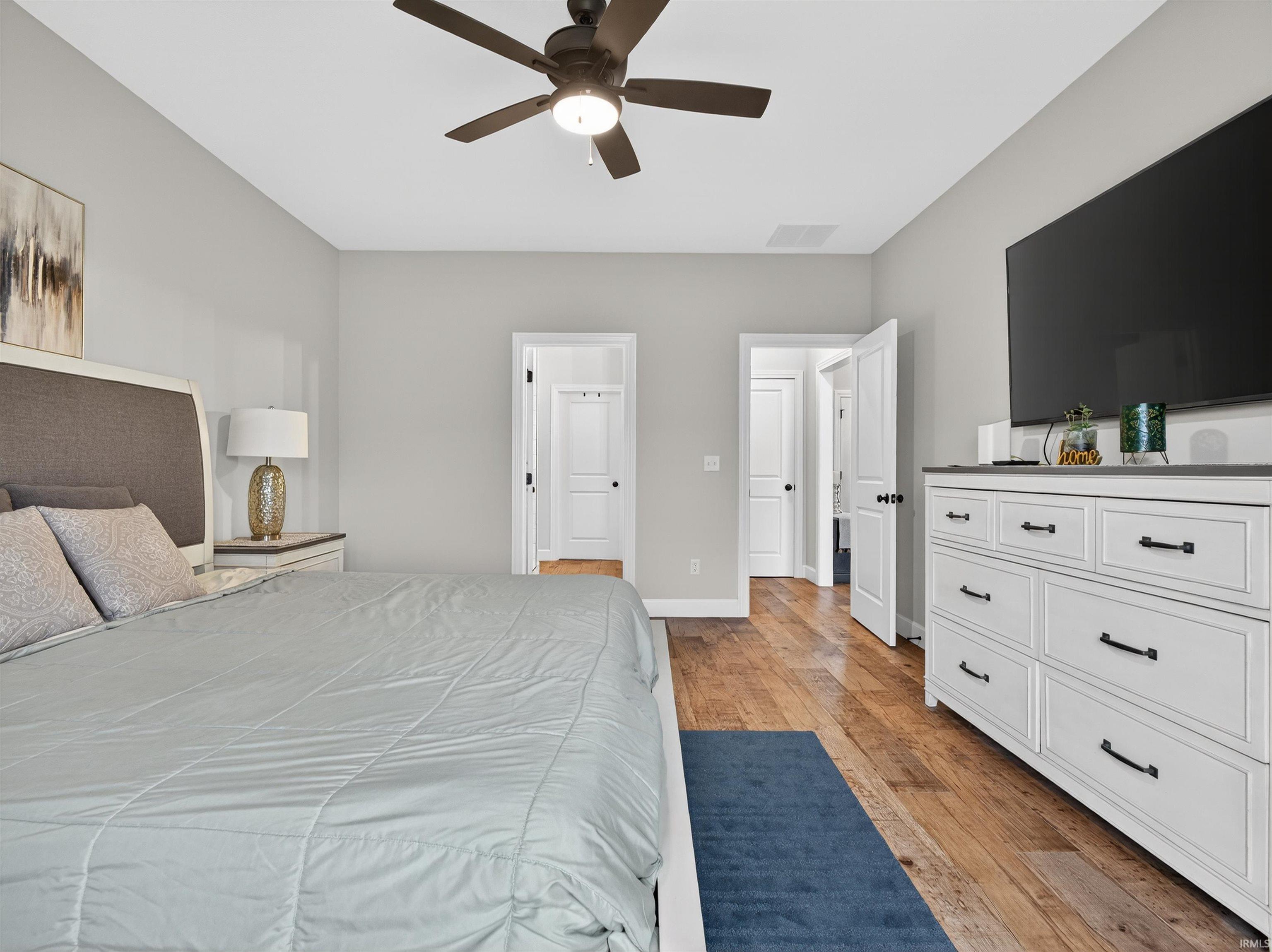 Bedroom featuring light wood-type flooring and ceiling fan