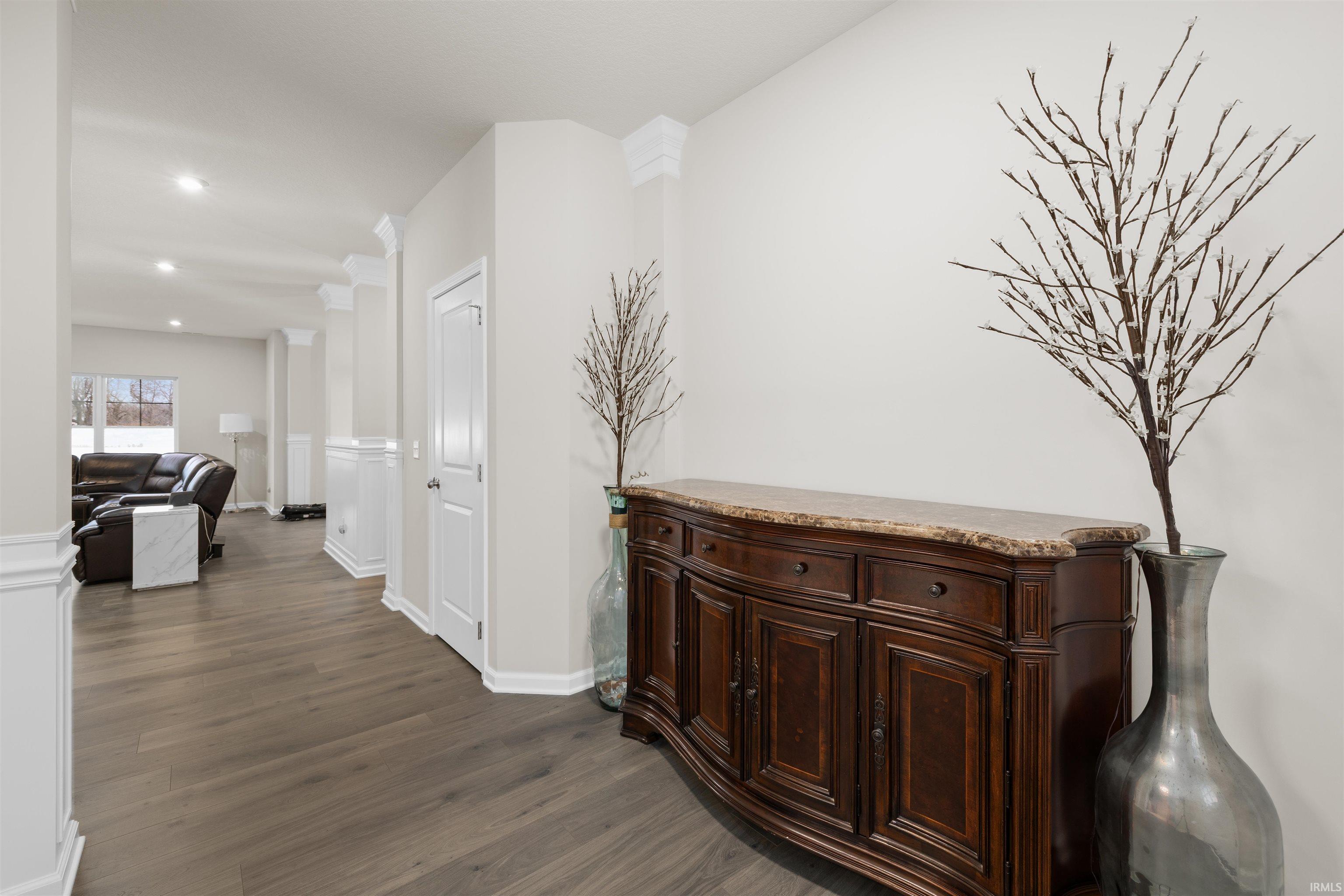 Hallway featuring dark wood-style flooring and recessed lighting