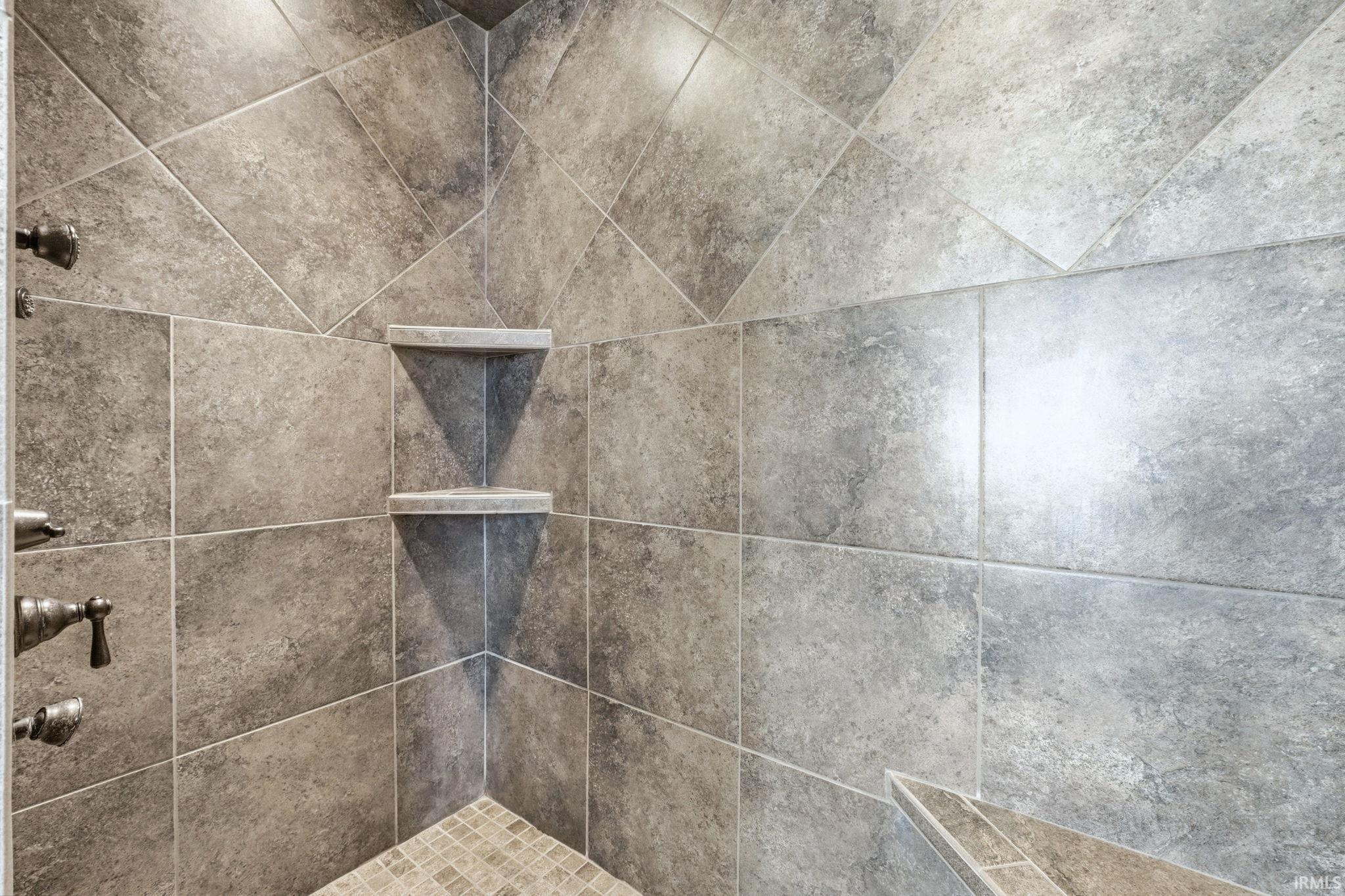 Bathroom view of a tile shower