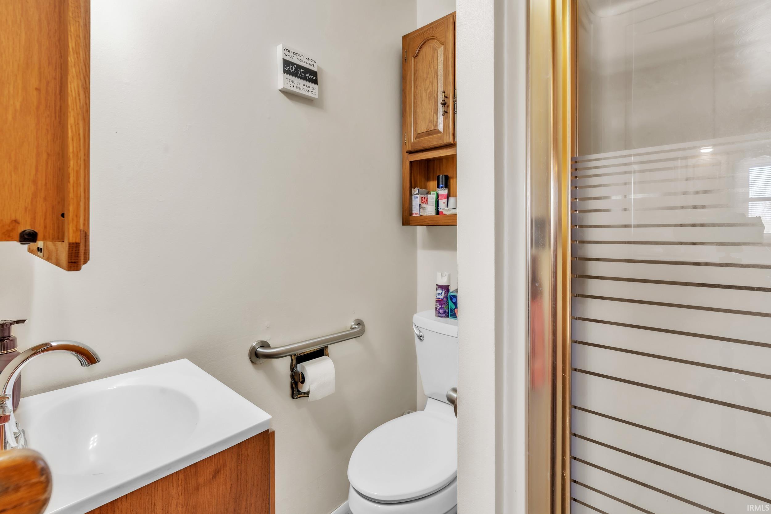 Bathroom featuring toilet and vanity