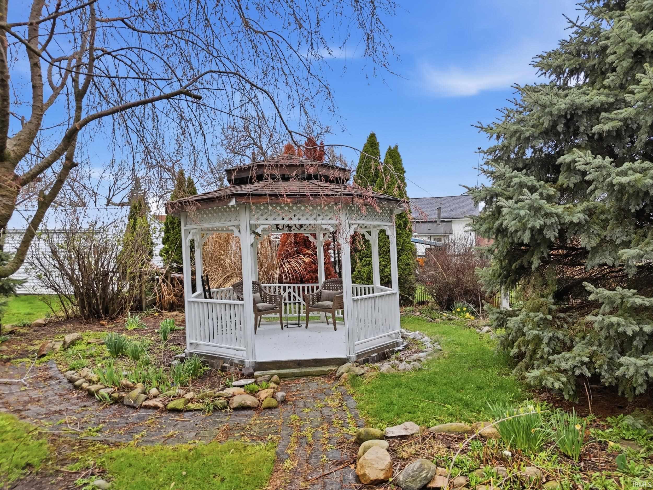 View of yard with a gazebo and a deck