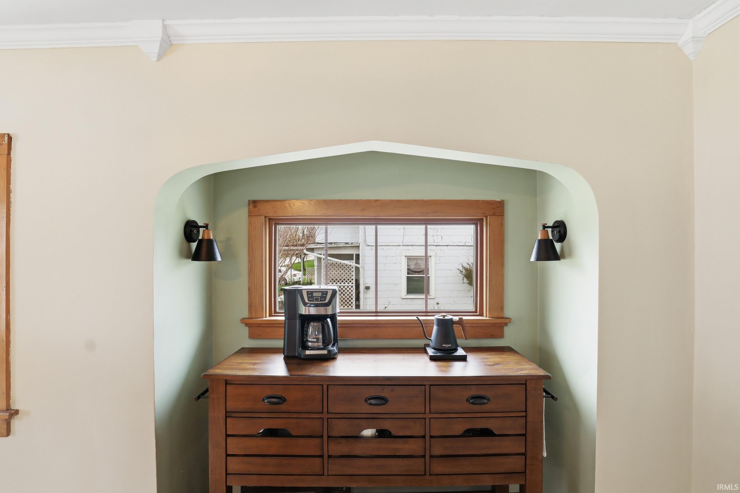 Detailed view of ornamental molding and arched walkways