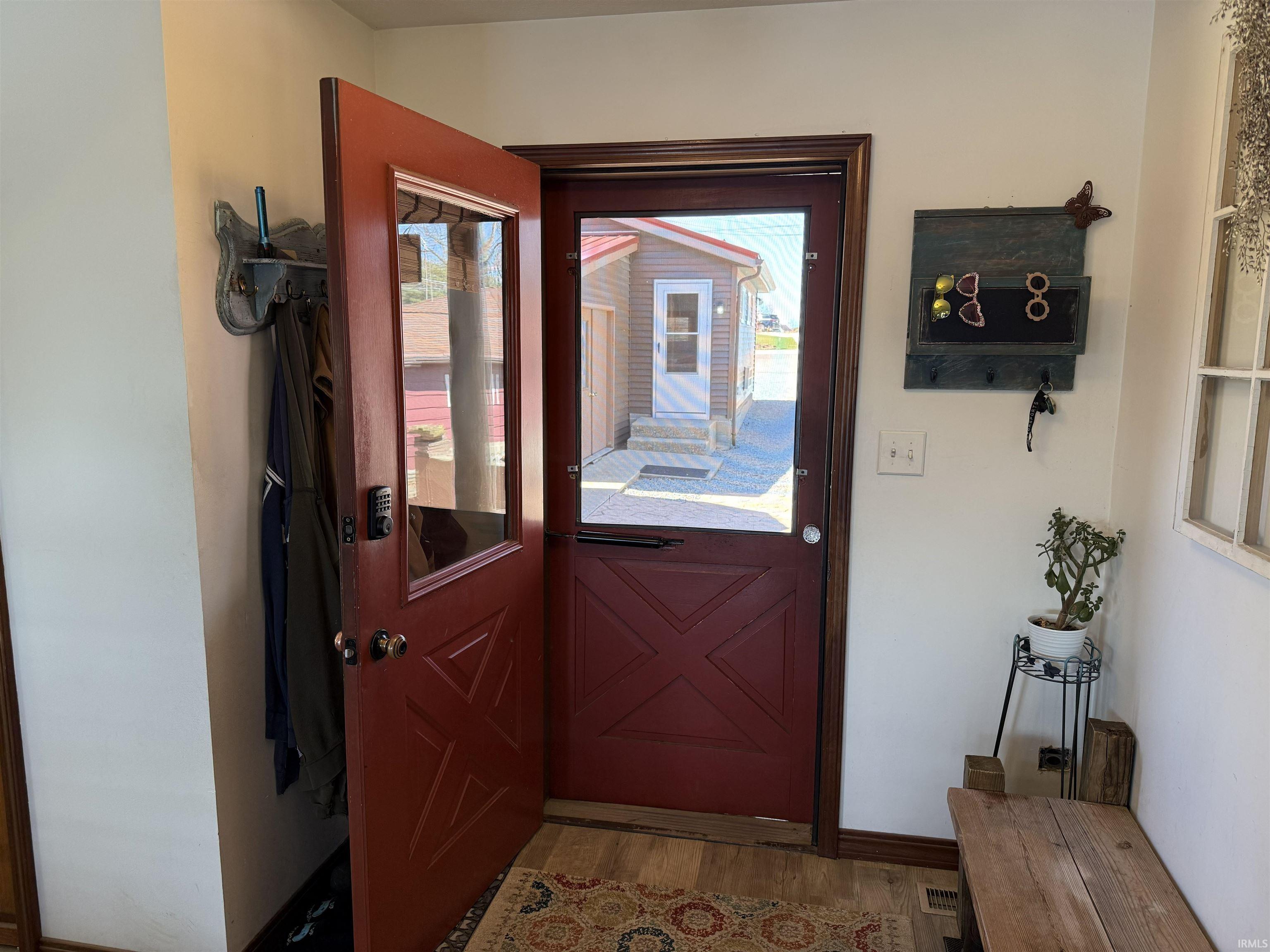 Doorway to outside featuring wood finished floors