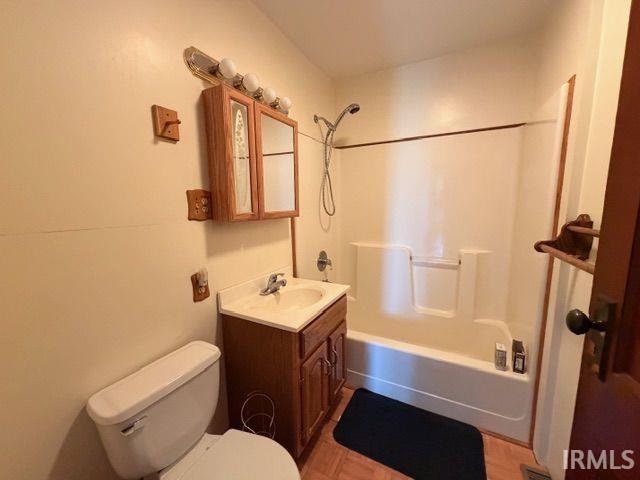 Bathroom with vanity and bathing tub / shower combination