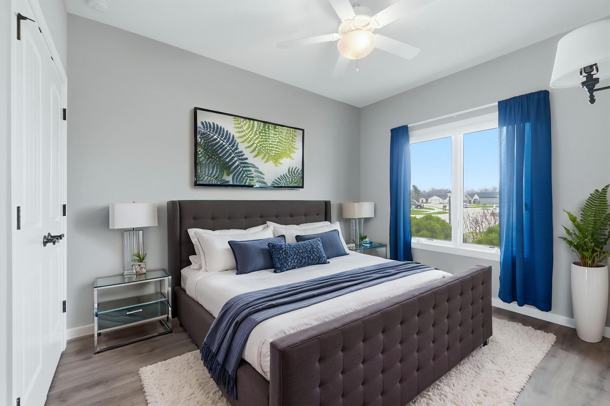 Bedroom featuring wood finished floors and ceiling fan