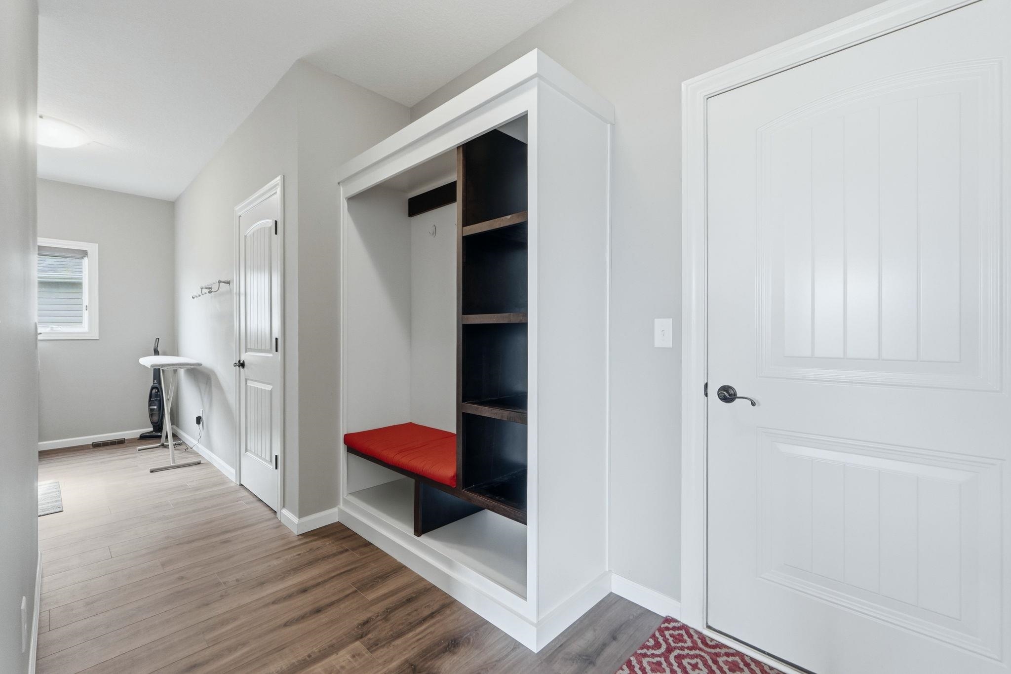 Mudroom with baseboards and light wood-style floors