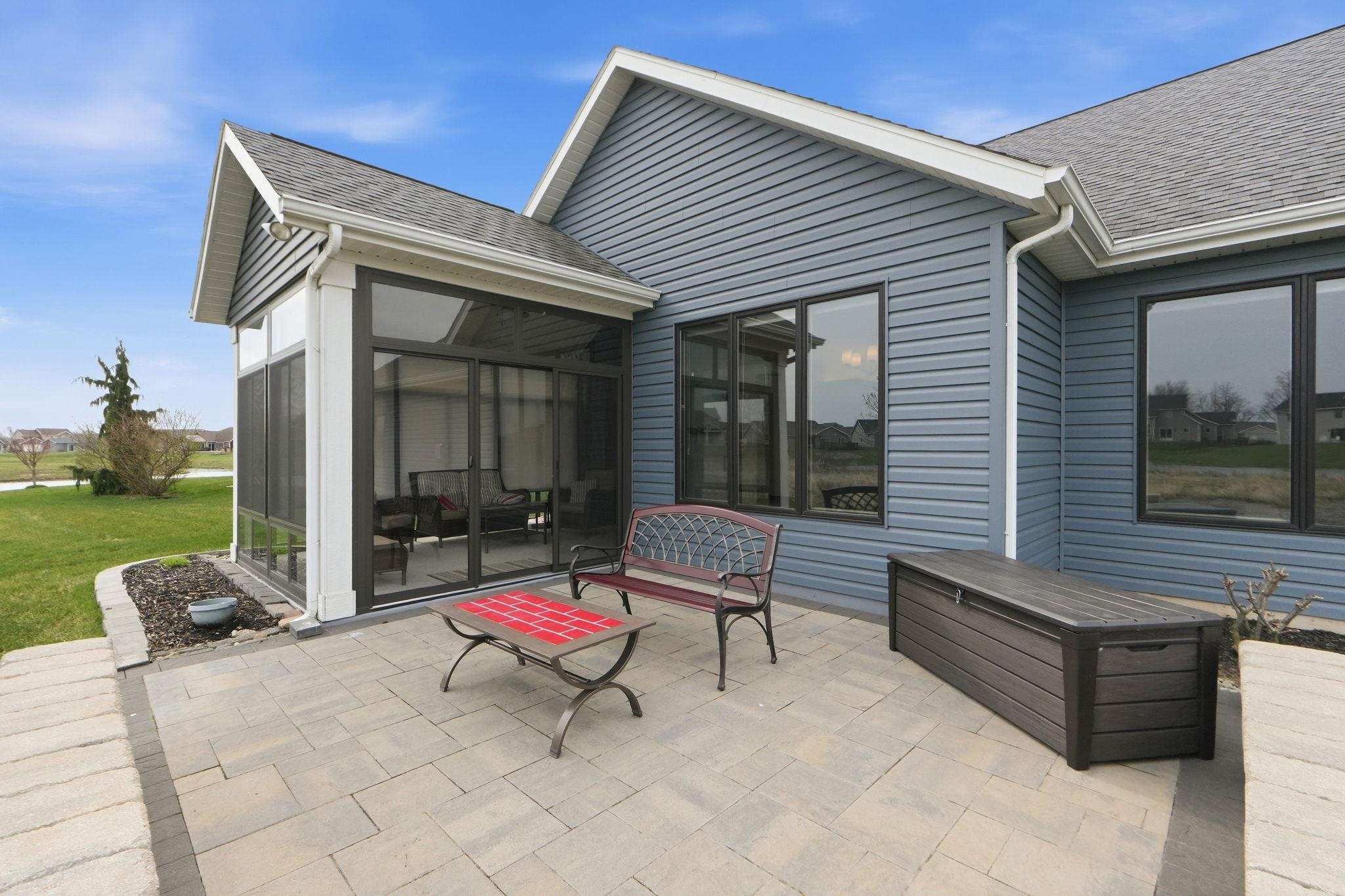 View of patio / terrace with a sunroom