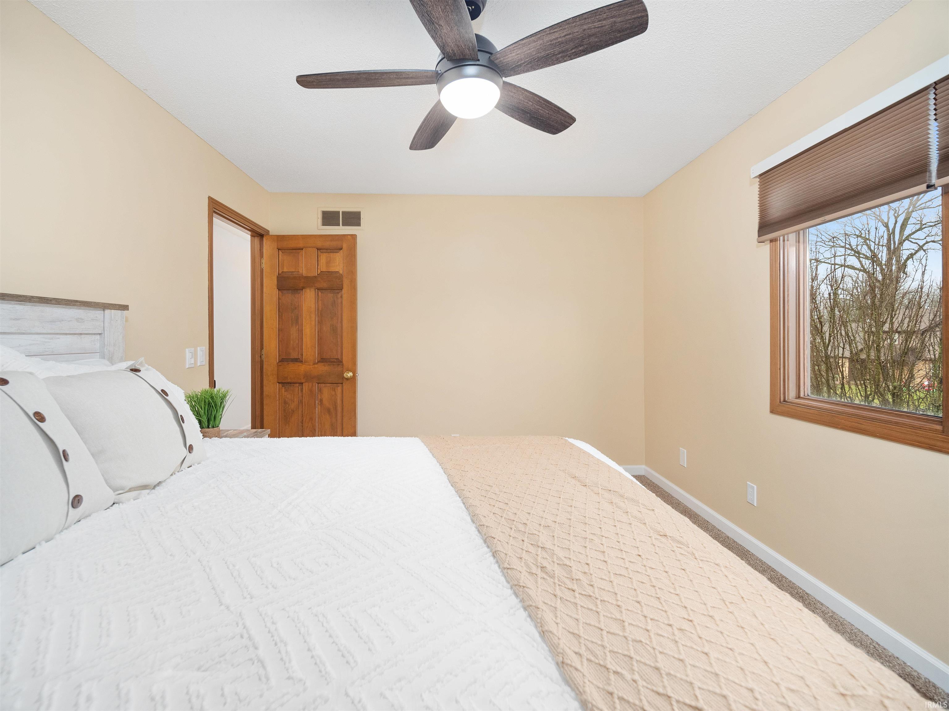 Bedroom with baseboards and ceiling fan