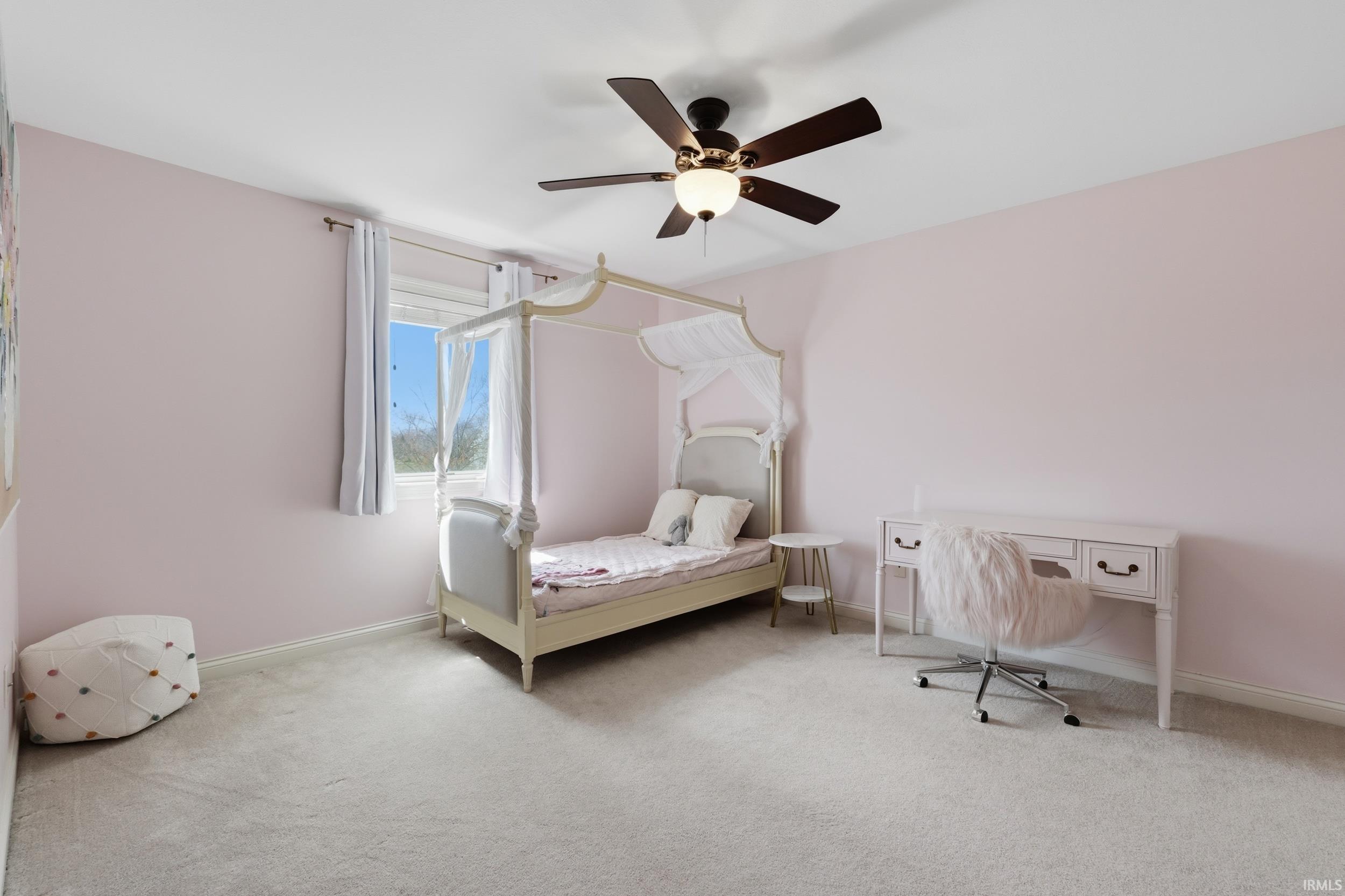 Bedroom with light carpet and ceiling fan