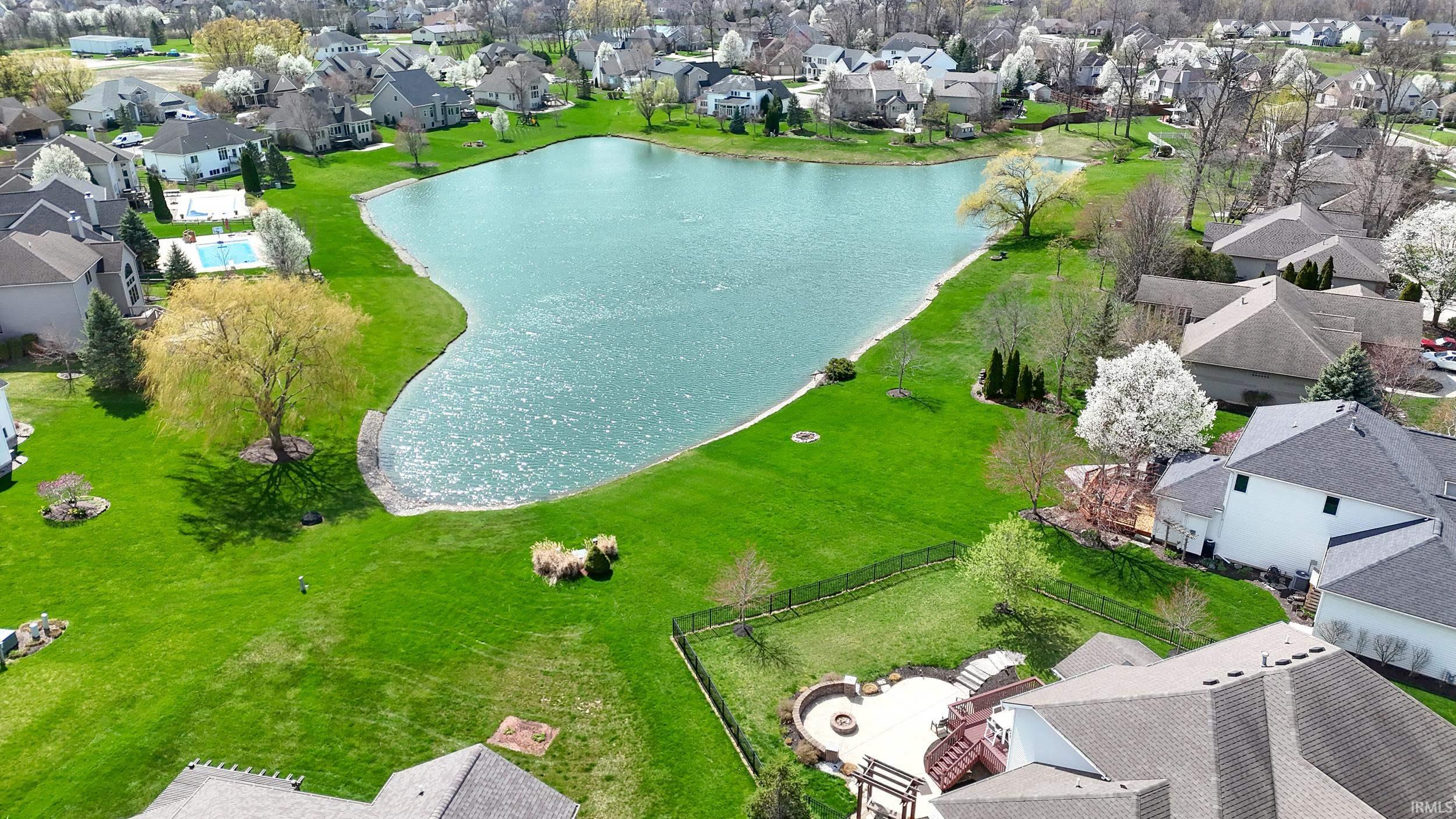 Aerial perspective of suburban area with a large body of water