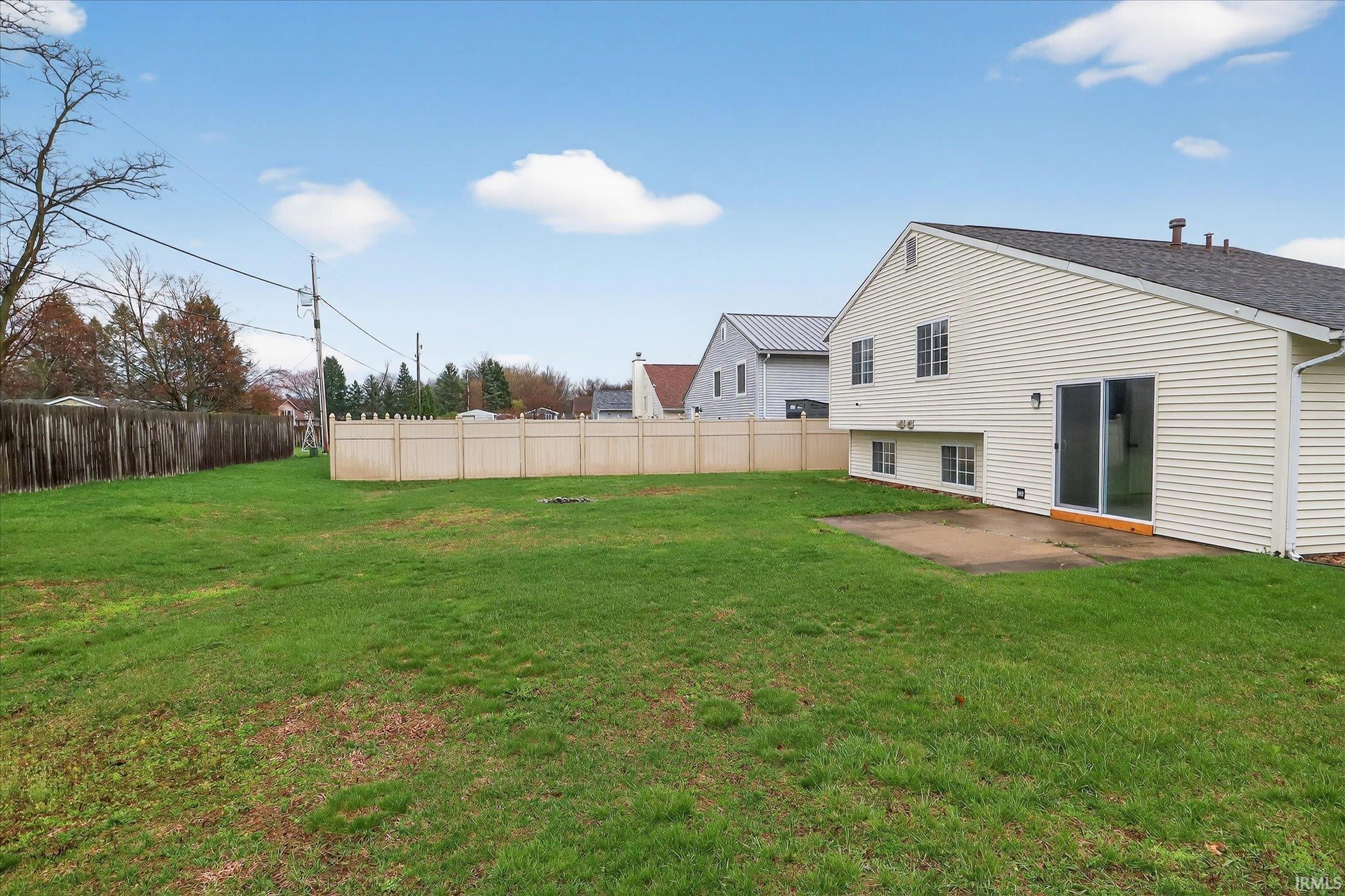 Fenced yard with a patio area