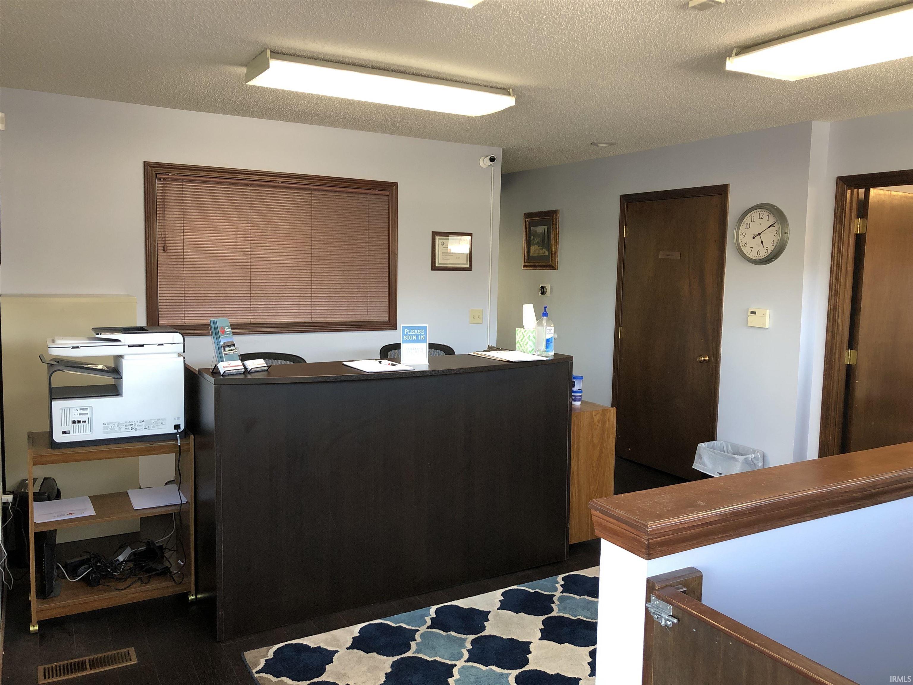 Office featuring a textured ceiling