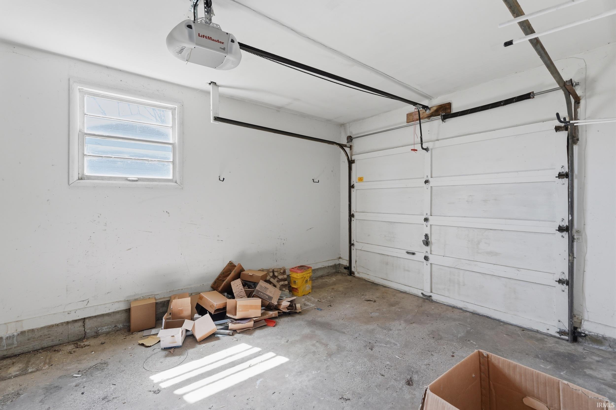 Garage featuring a garage door opener