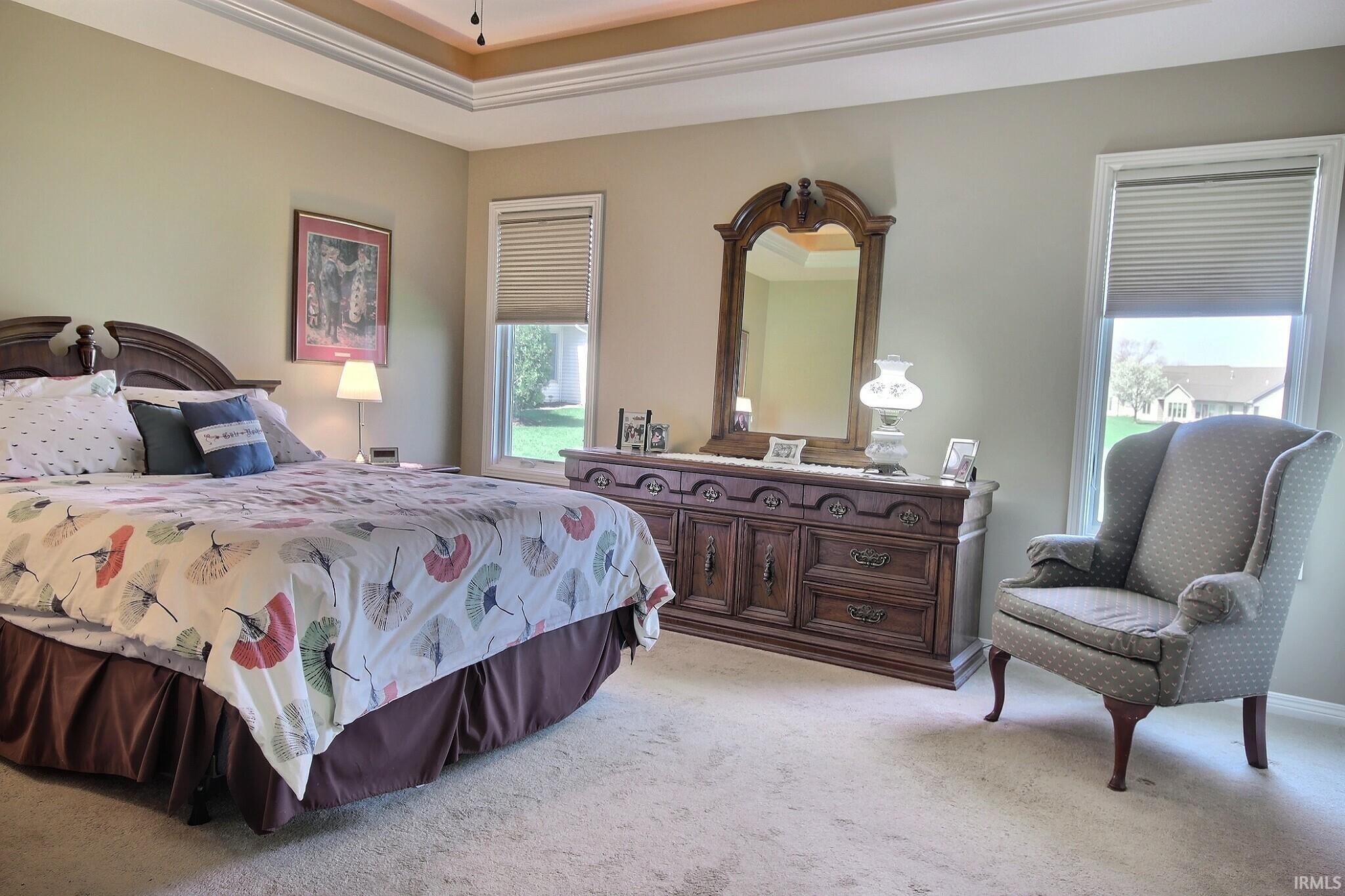 Bedroom with light carpet