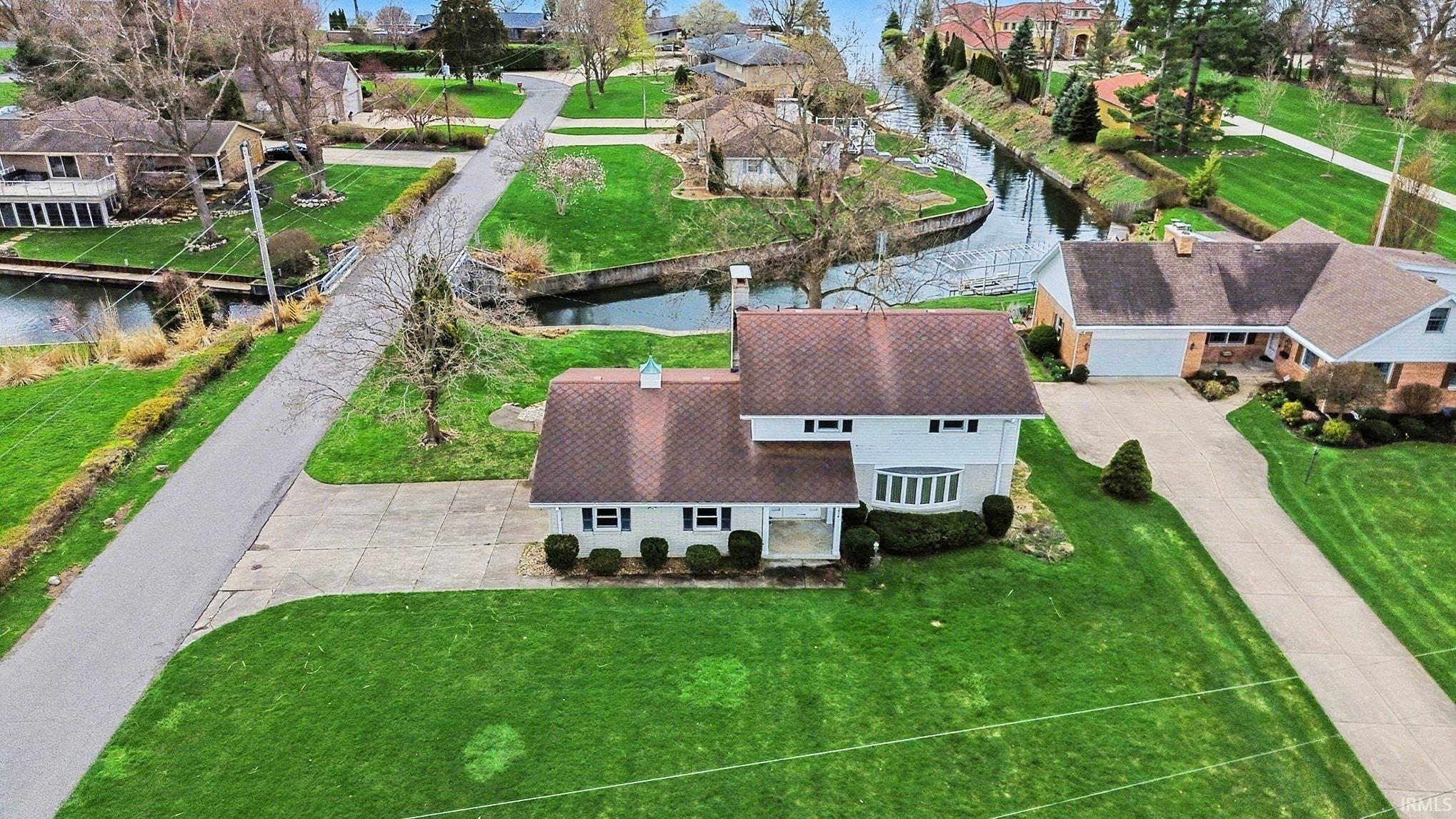 Aerial view of residential area with a nearby body of water