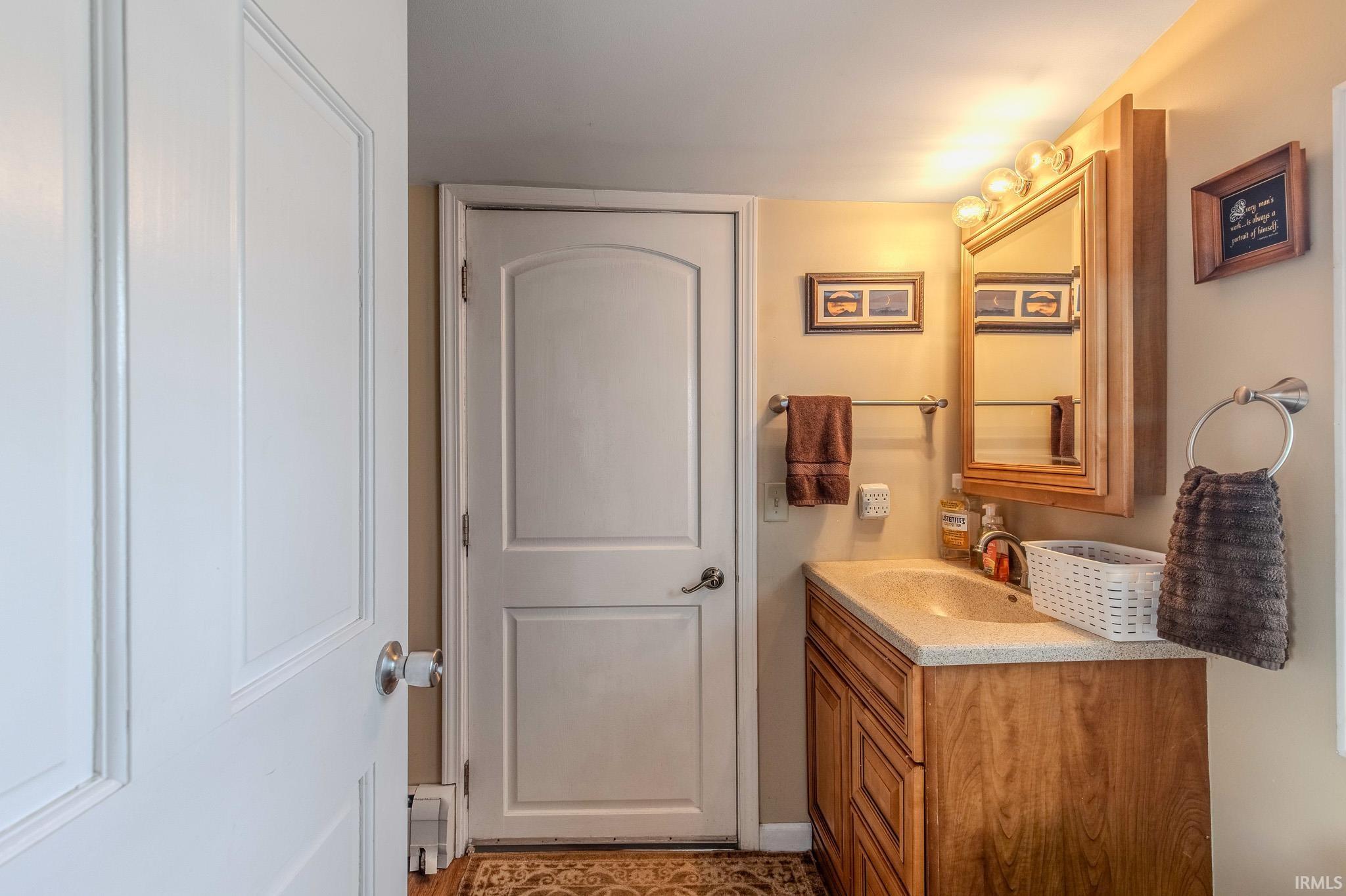 Bathroom with vanity and a baseboard radiator