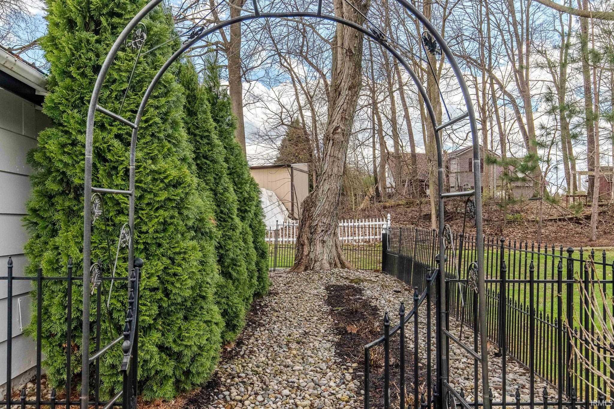 View of yard featuring a gate