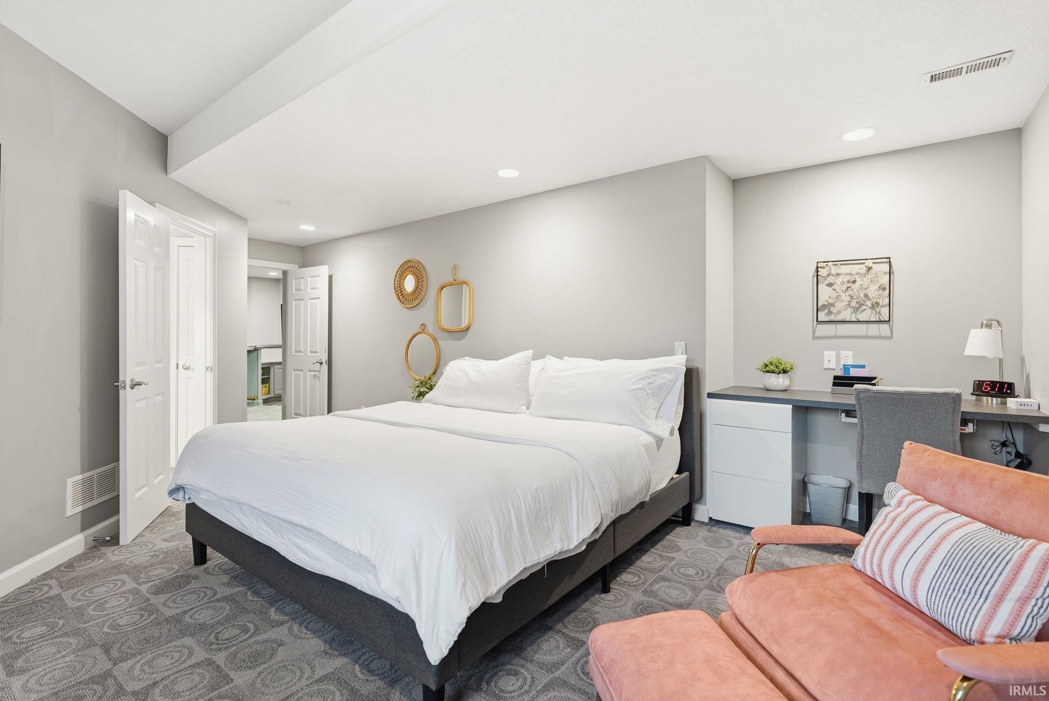 Bedroom with recessed lighting and carpet