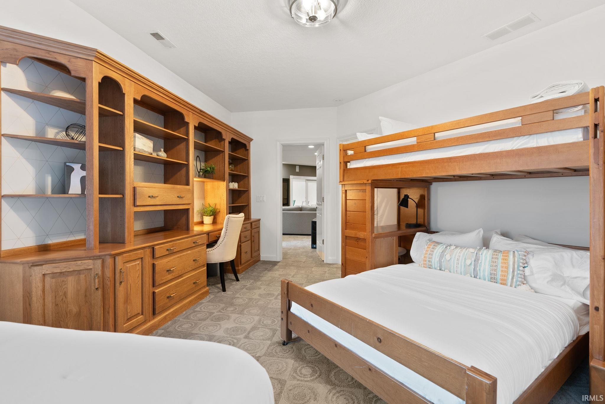 Bedroom with built in desk