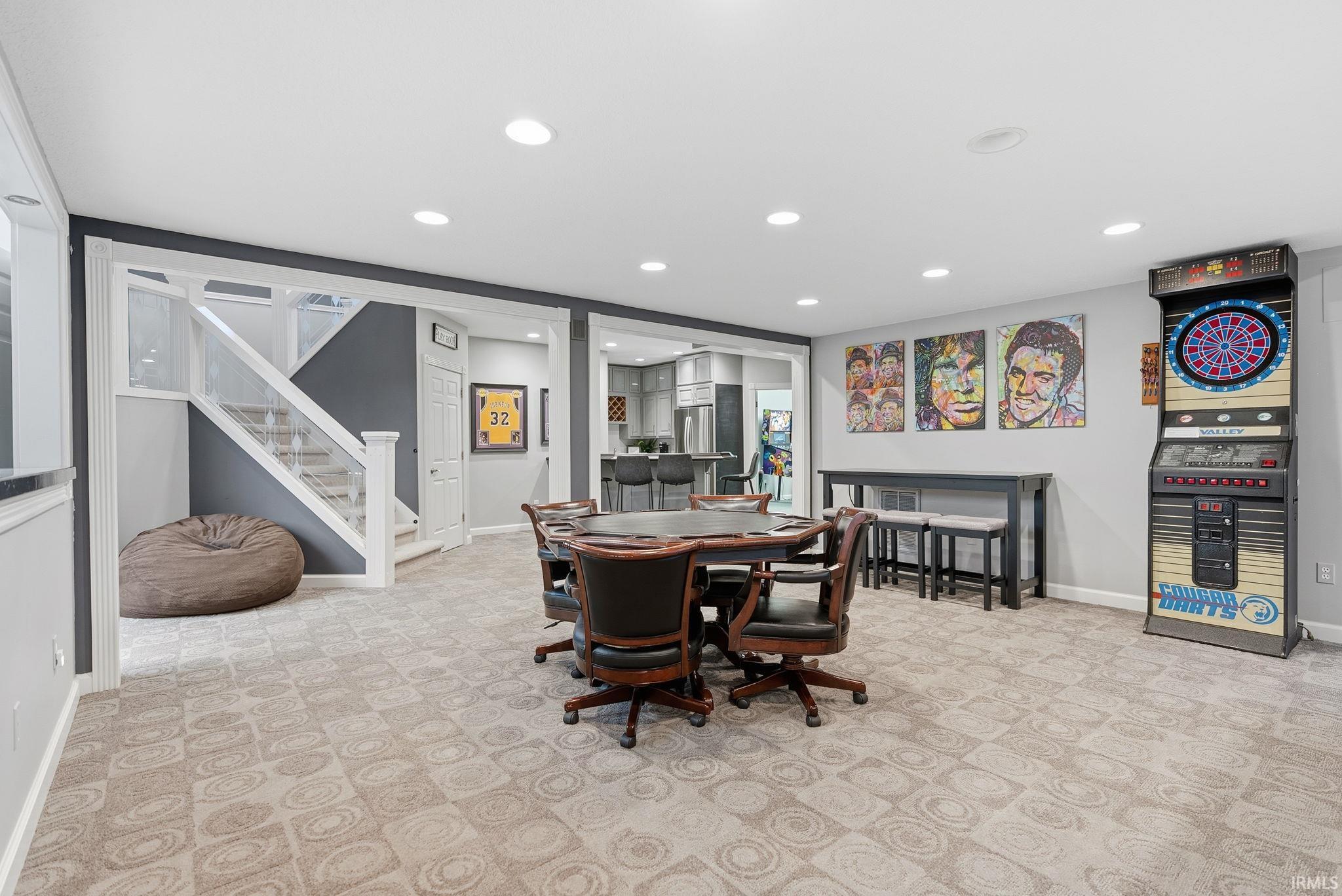 Dining area featuring recessed lighting and light carpet
