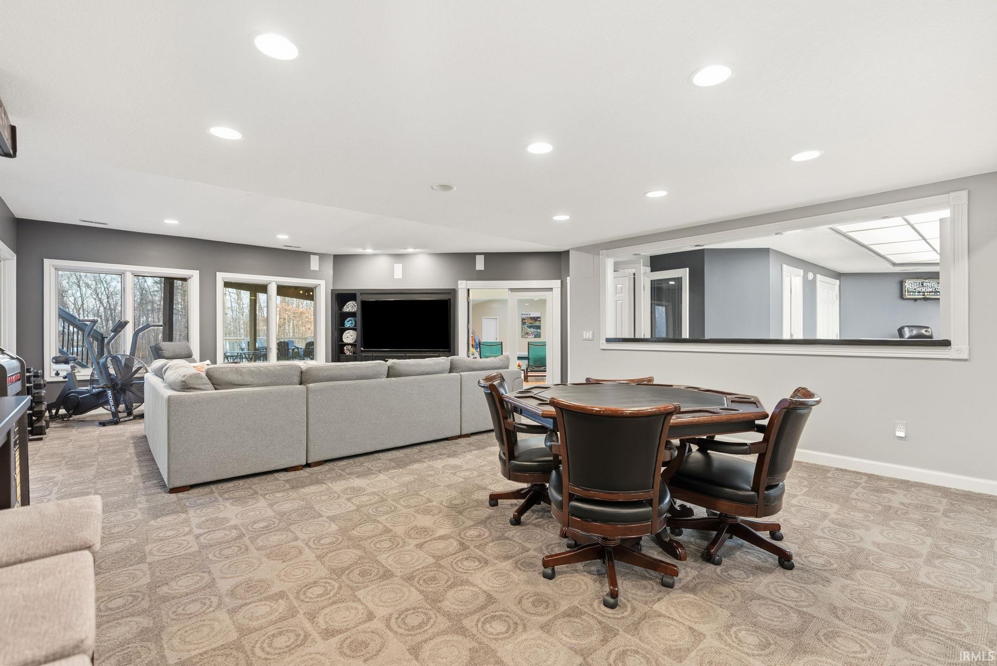 Dining space with recessed lighting and baseboards