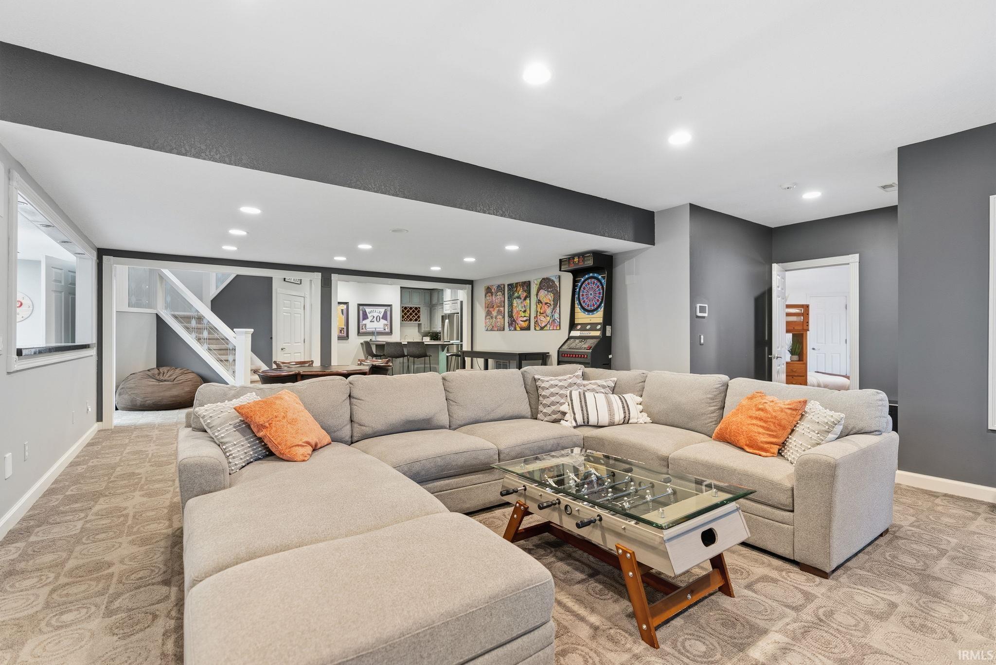 Living area with baseboards and recessed lighting