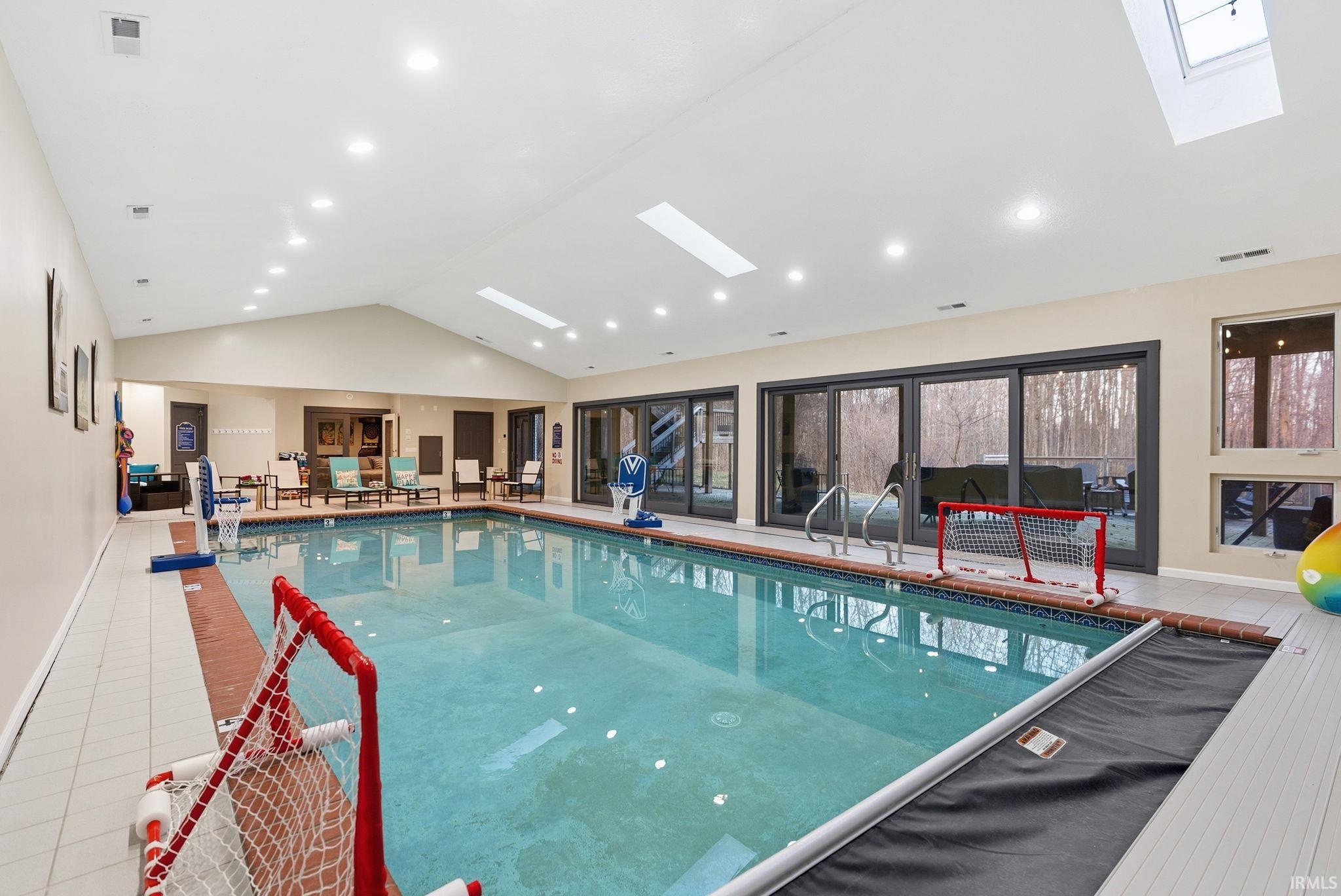 Indoor community pool with a skylight