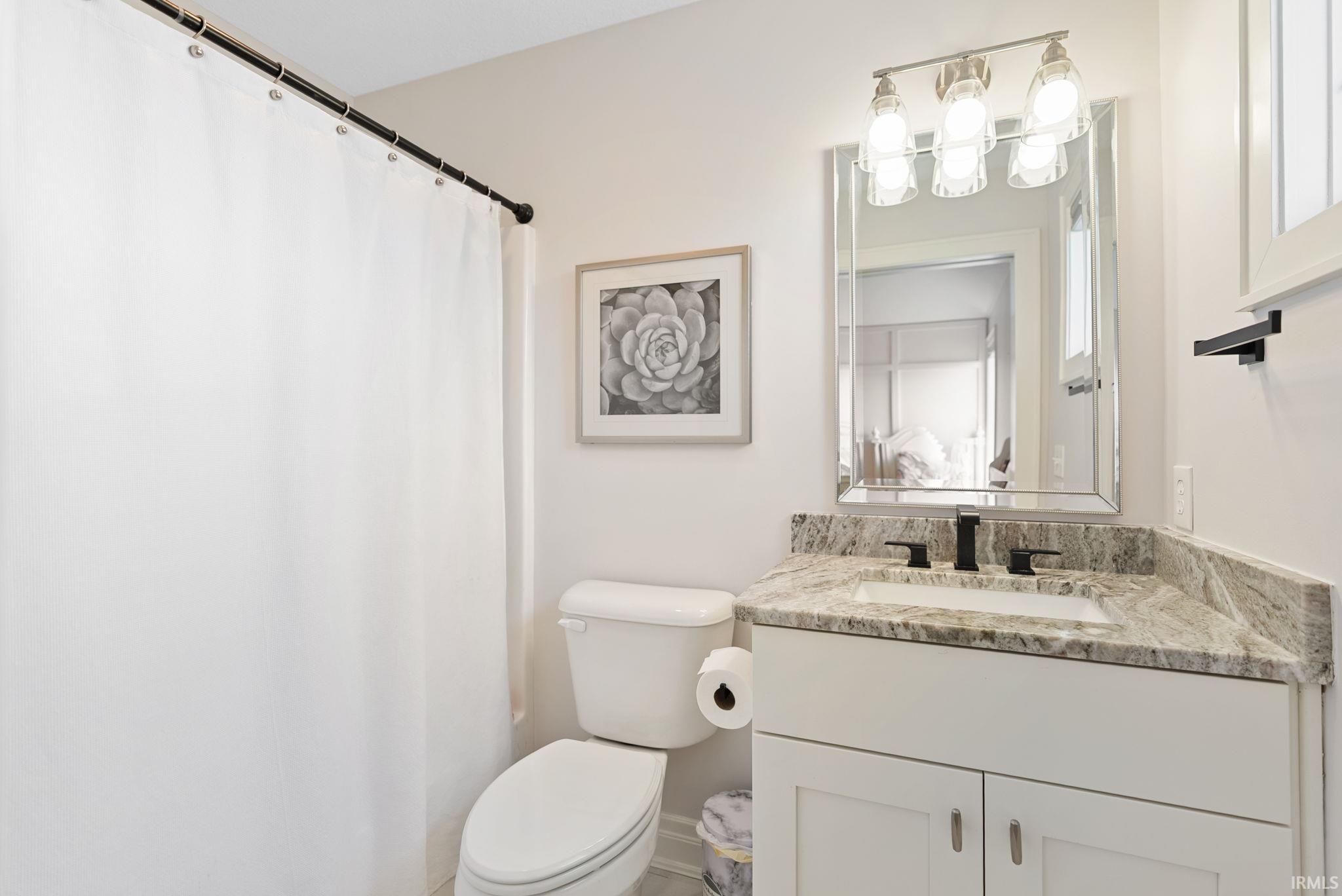Bathroom with vanity and a shower with curtain