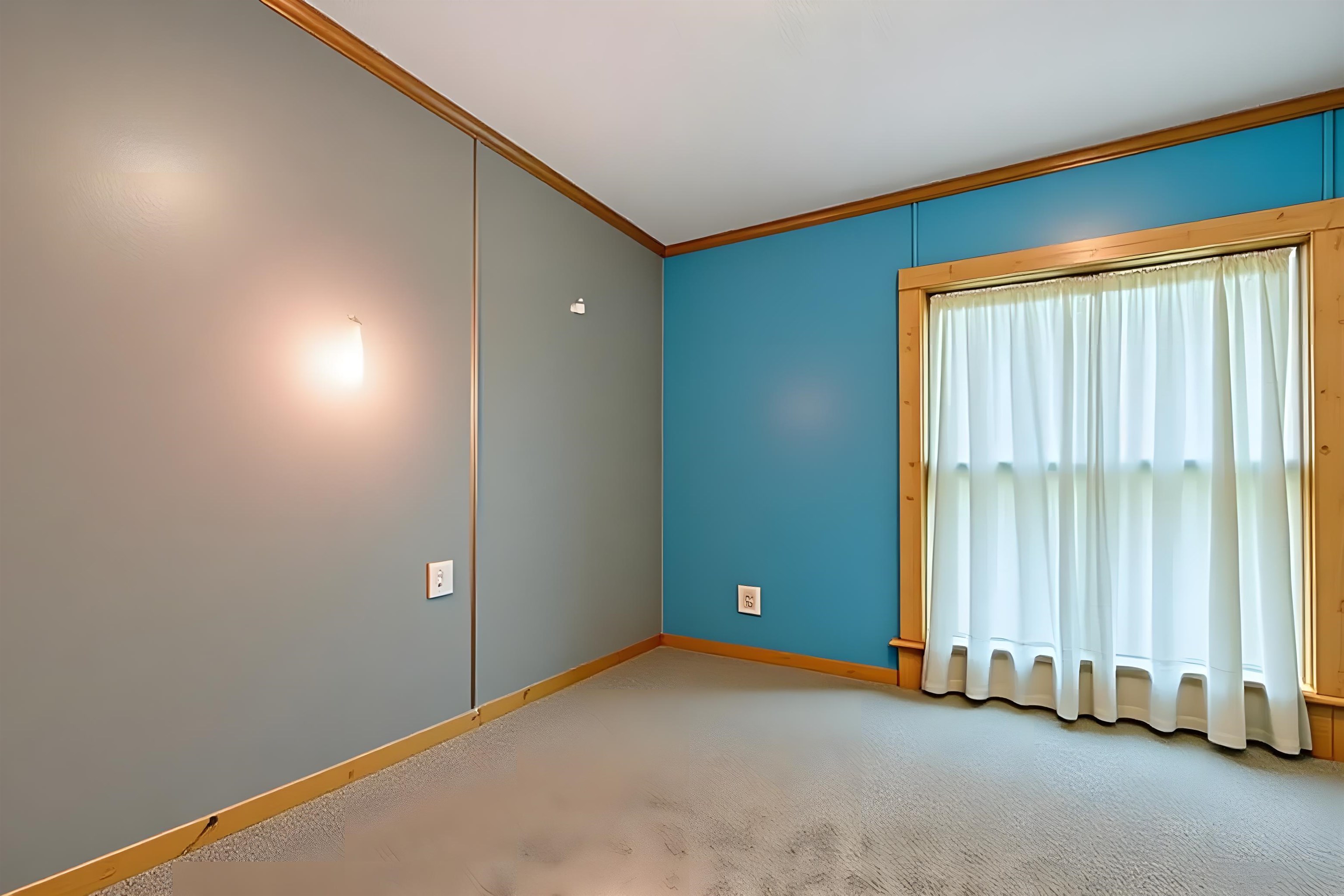 Empty room with crown molding and light carpet
