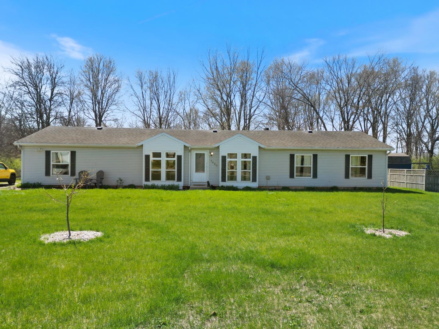 Single story home featuring a front yard