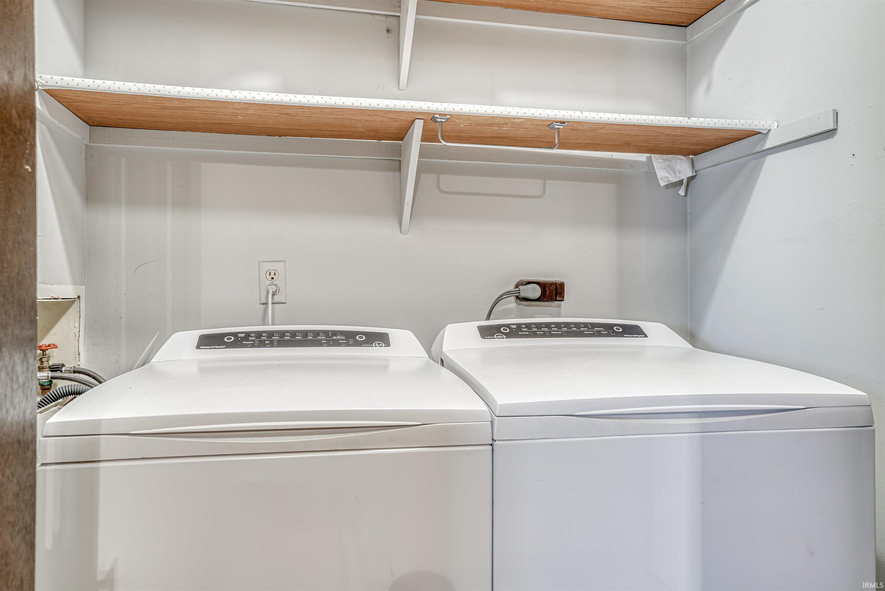 Laundry area featuring independent washer and dryer