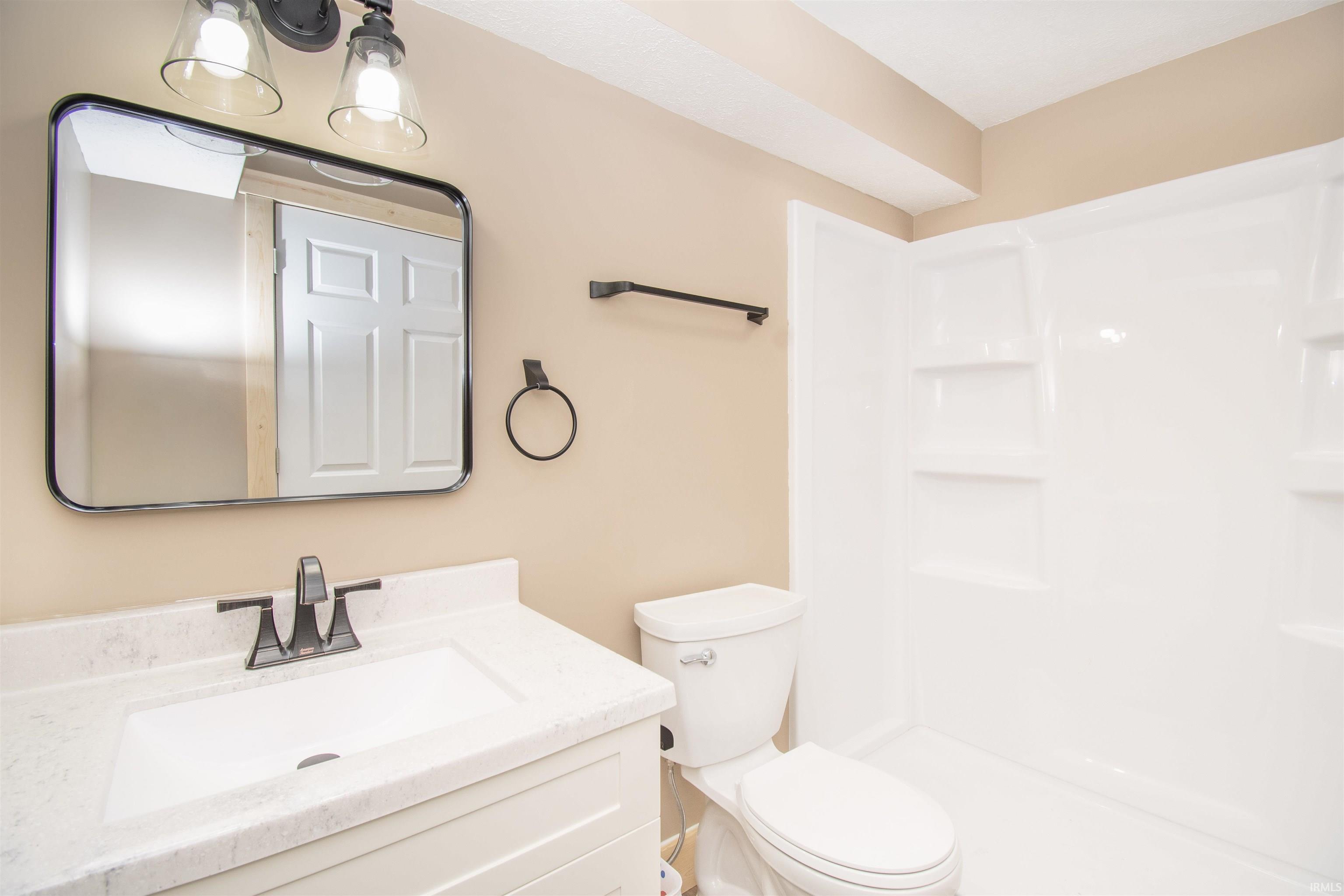 Full bath with vanity and walk in shower