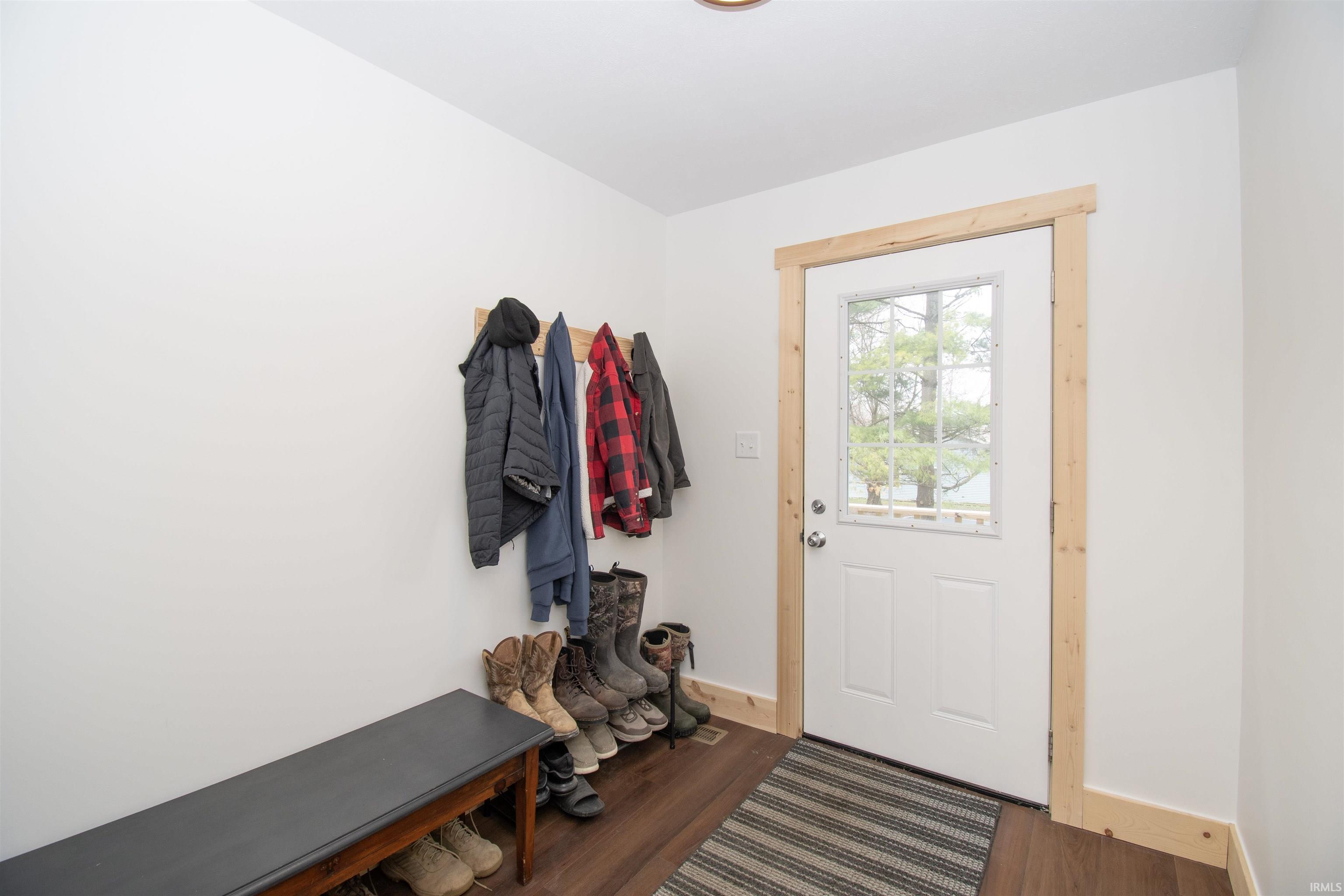 Mudroom with dark wood-style floors