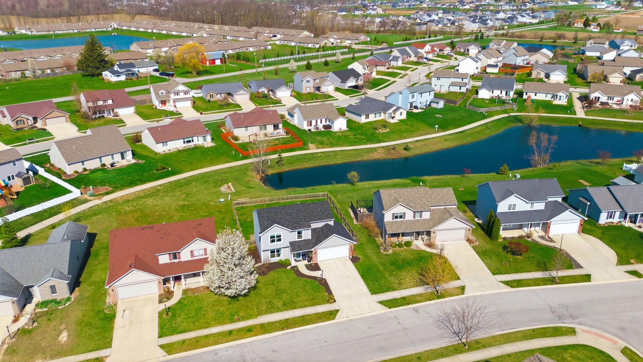 Aerial view of residential area featuring a large body of water