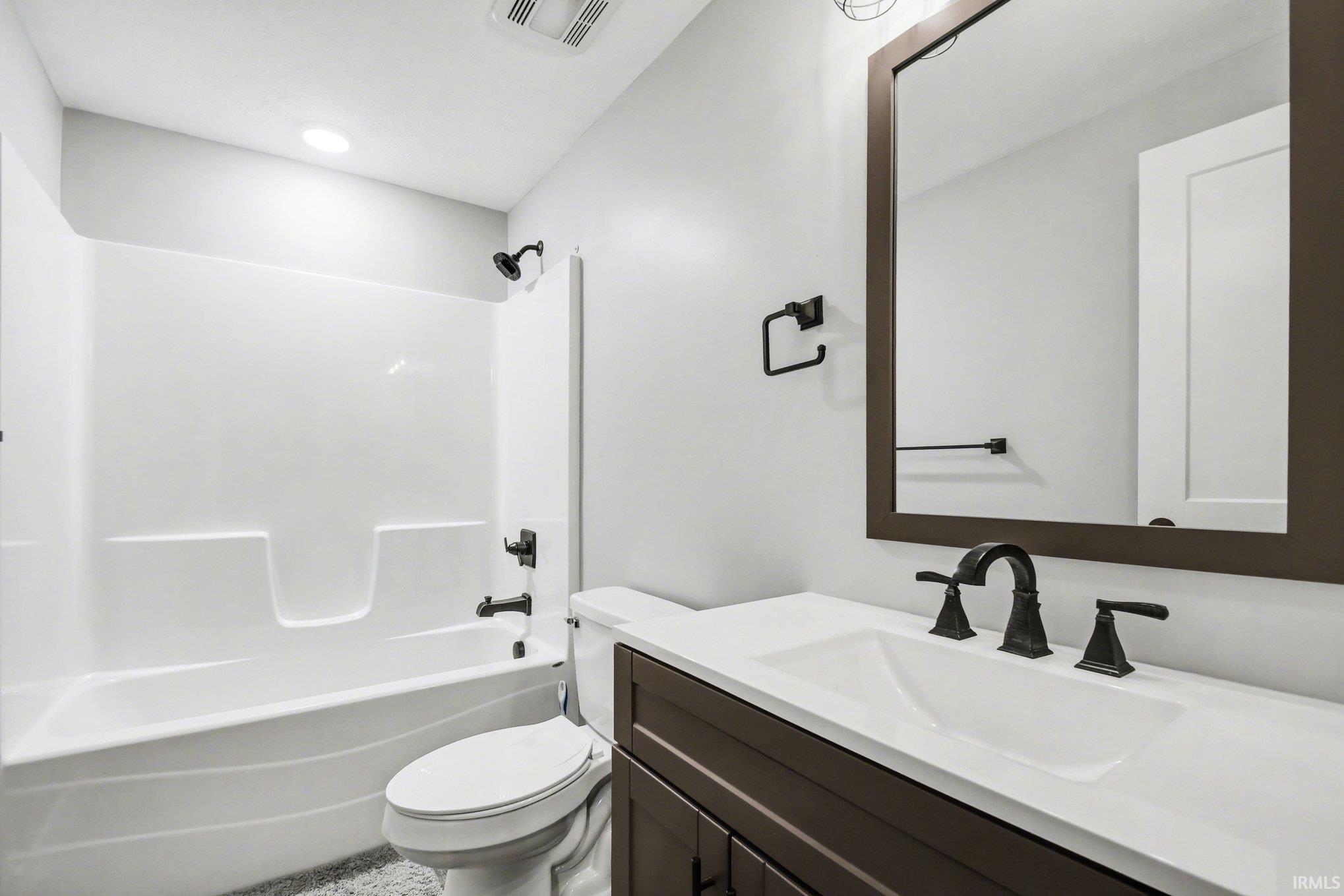 Full bathroom featuring vanity and tub / shower combination