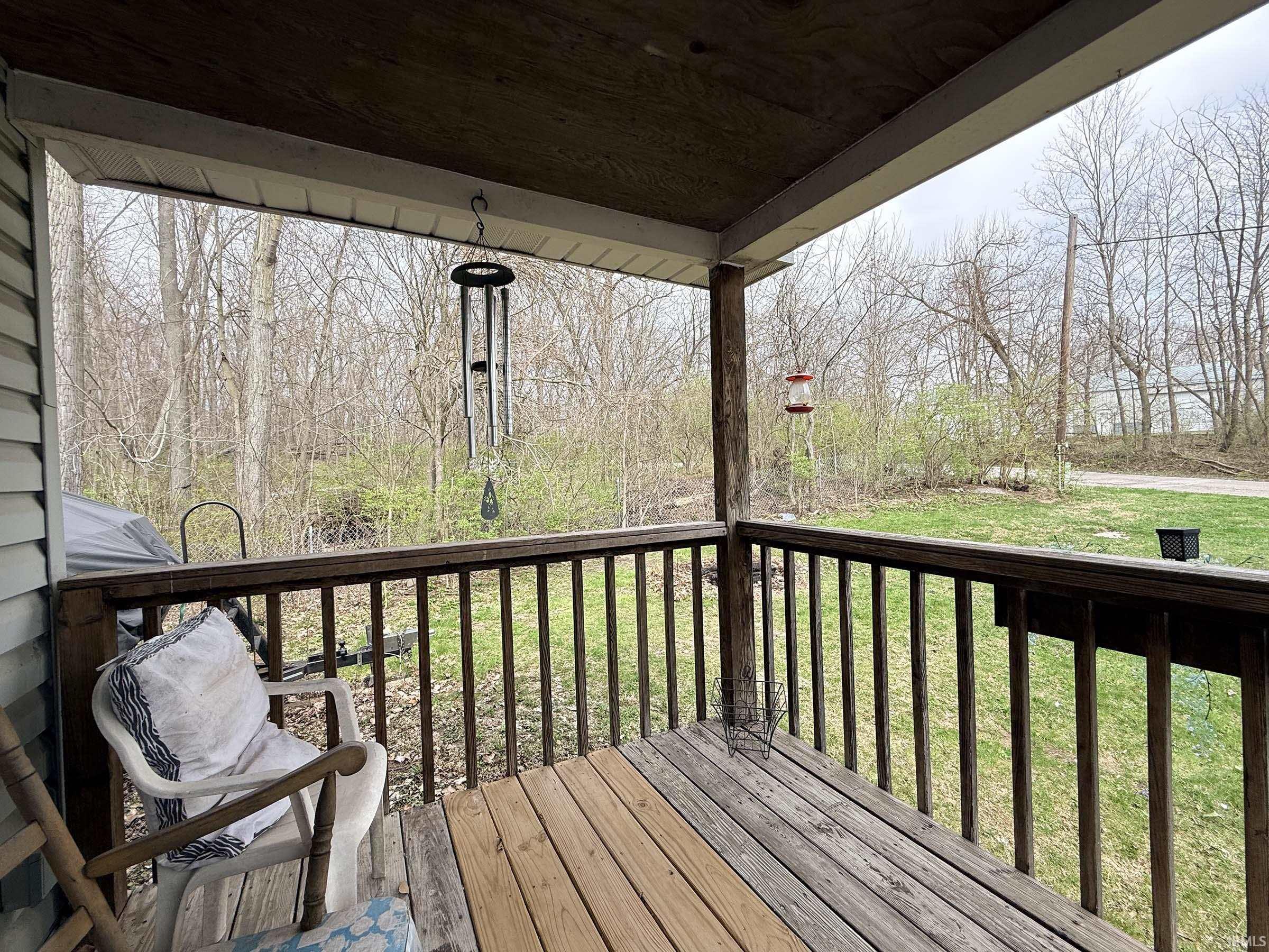 Wooden deck with a yard